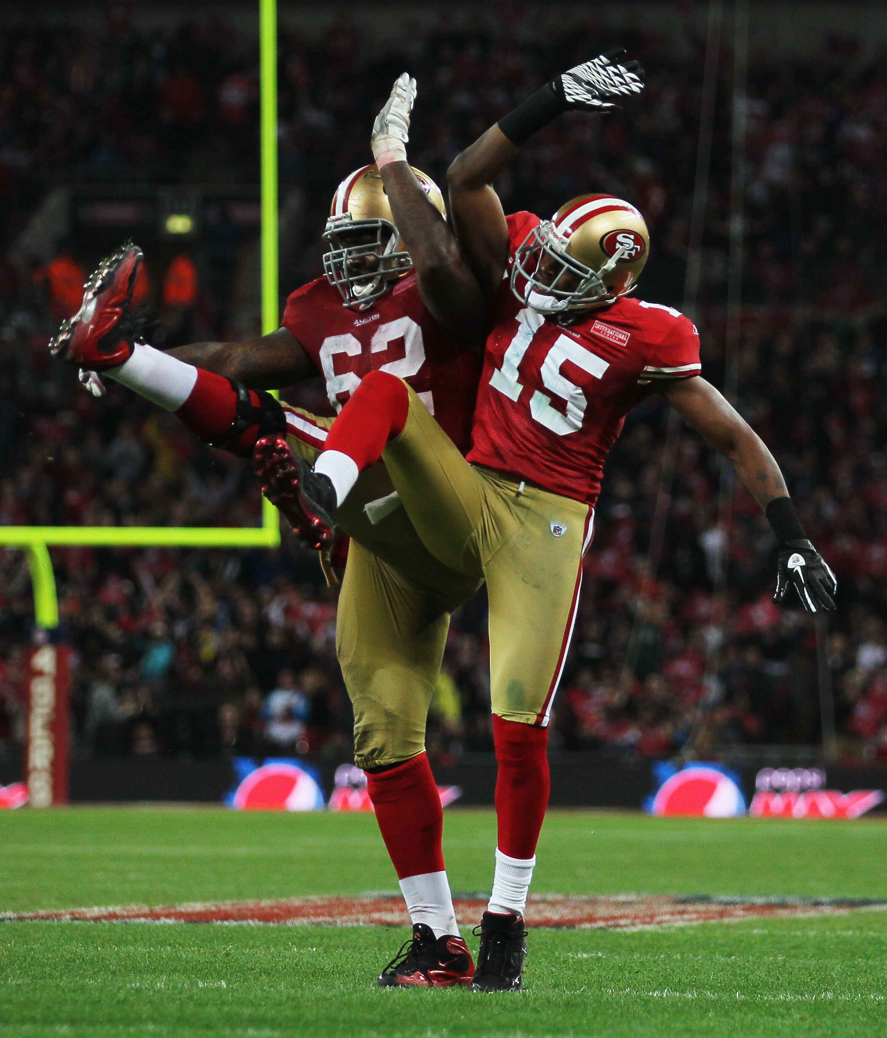 LONDON, ENGLAND - OCTOBER 31:  Michael Crabtree #15 of San Francisco 49ers celebrates with  Chilo Rachal #62 as he scores their second touchdown during the NFL International Series match between Denver Broncos and San Francisco 49ers at Wembley Stadium on