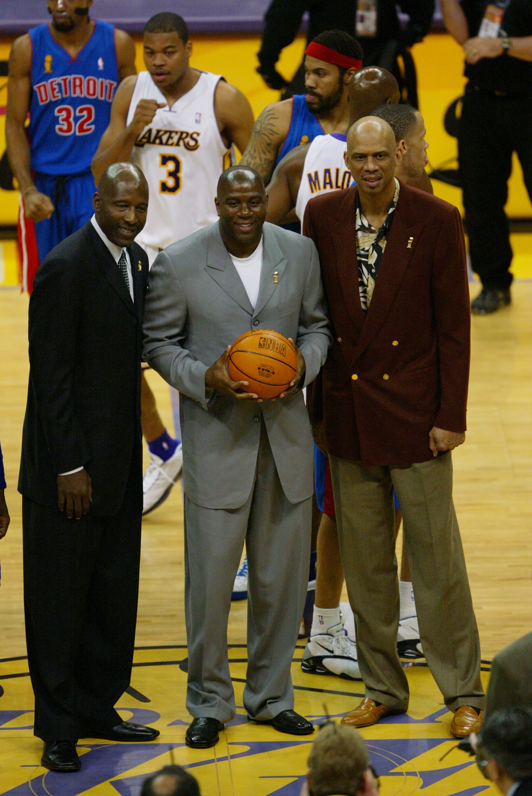 LOS ANGELES - JUNE 6:  (Left to Right) James Worthy stands next to Earvin 'Magic' Johnson, and Kareem Abdul-Jabbar before Game 1 of the 2004 NBA Finals between the Los Angeles Lakers and the Detroit Pistons at Staples Center on June 6, 2004 in Los Angeles