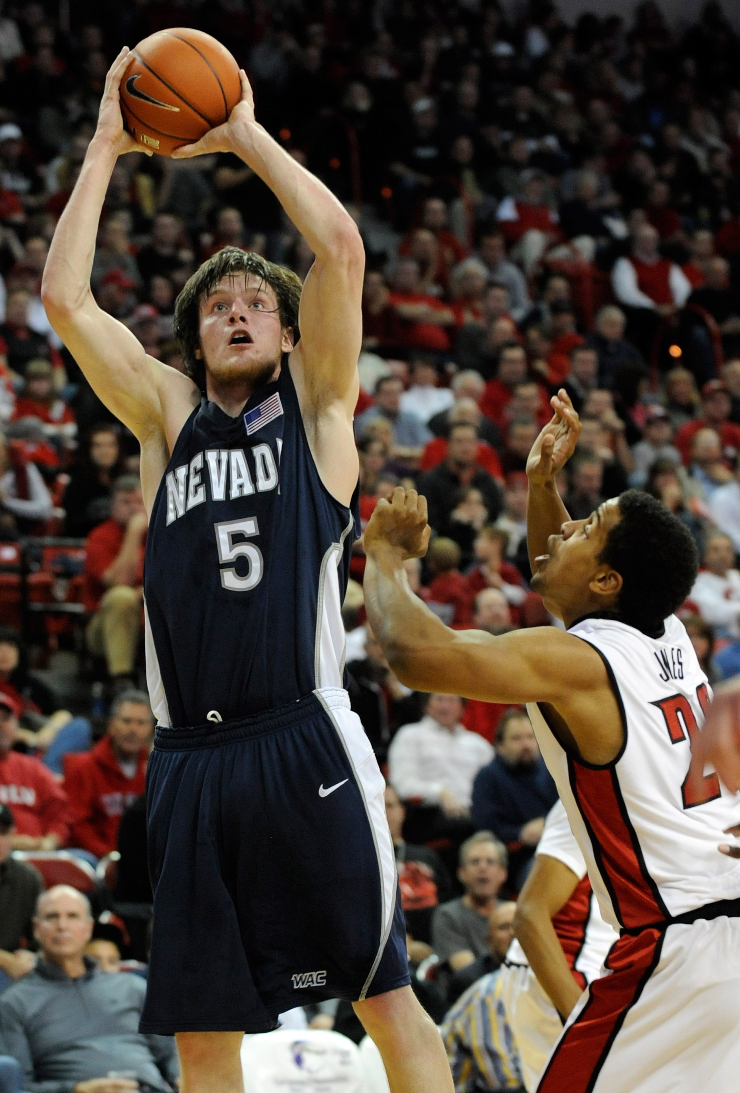 LAS VEGAS - NOVEMBER 18:  Luke Babbitt #5 of the Nevada Wolf Pack shoots over Steve Jones #20 of the UNLV Rebels during their game at the Thomas & Mack Center on November 18, 2009 in Las Vegas, Nevada. UNLV won 88-75.  (Photo by Ethan Miller/Getty Images)