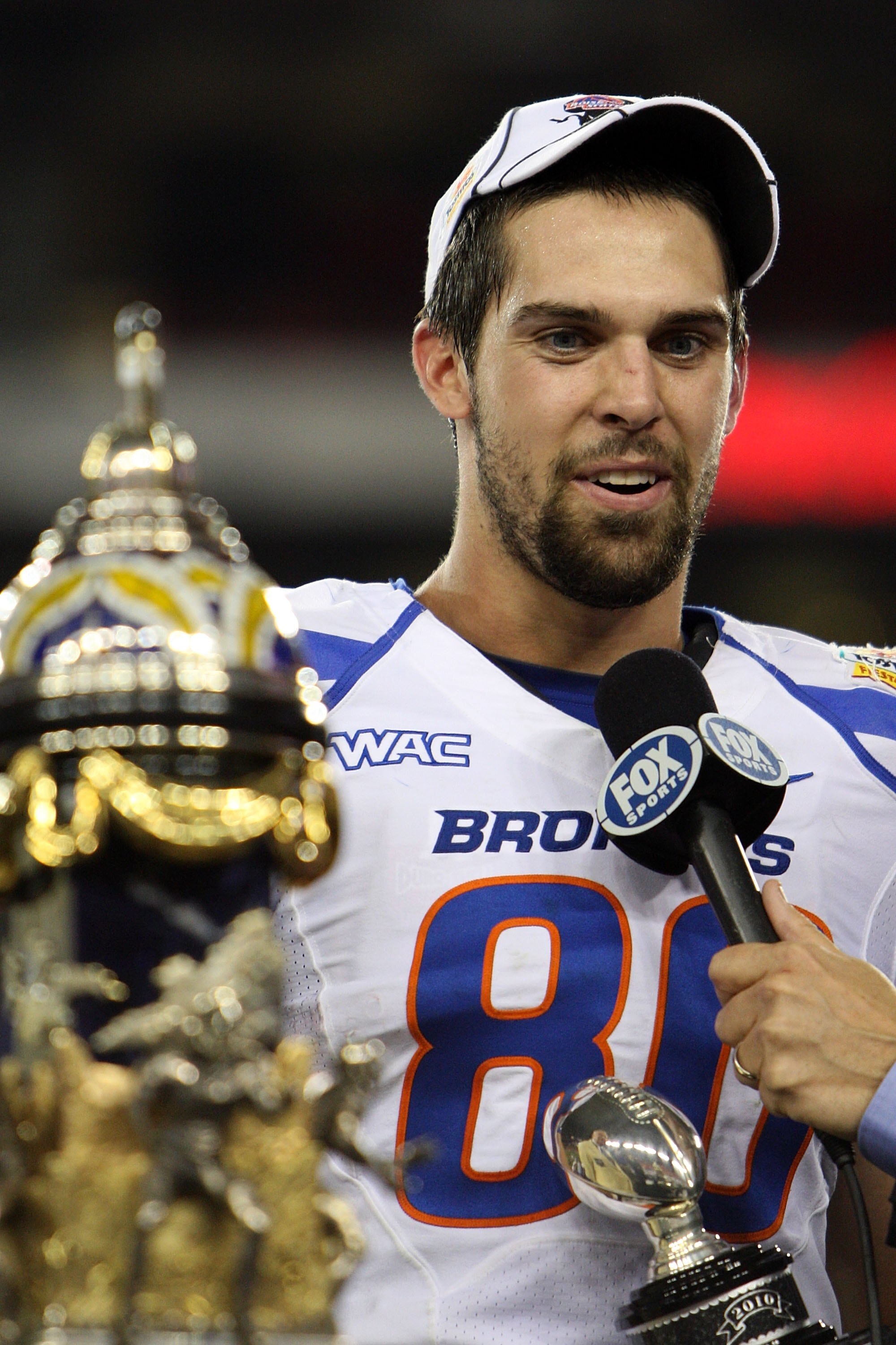 GLENDALE, AZ - JANUARY 04:  Kyle Efaw #80 of the Boise State Broncos celebrates with his offensive MVP award after defeating the TCU Horned Frogs 17-10 during the Tostitos Fiesta Bowl at the Universtity of Phoenix Stadium on January 4, 2010 in Glendale, A
