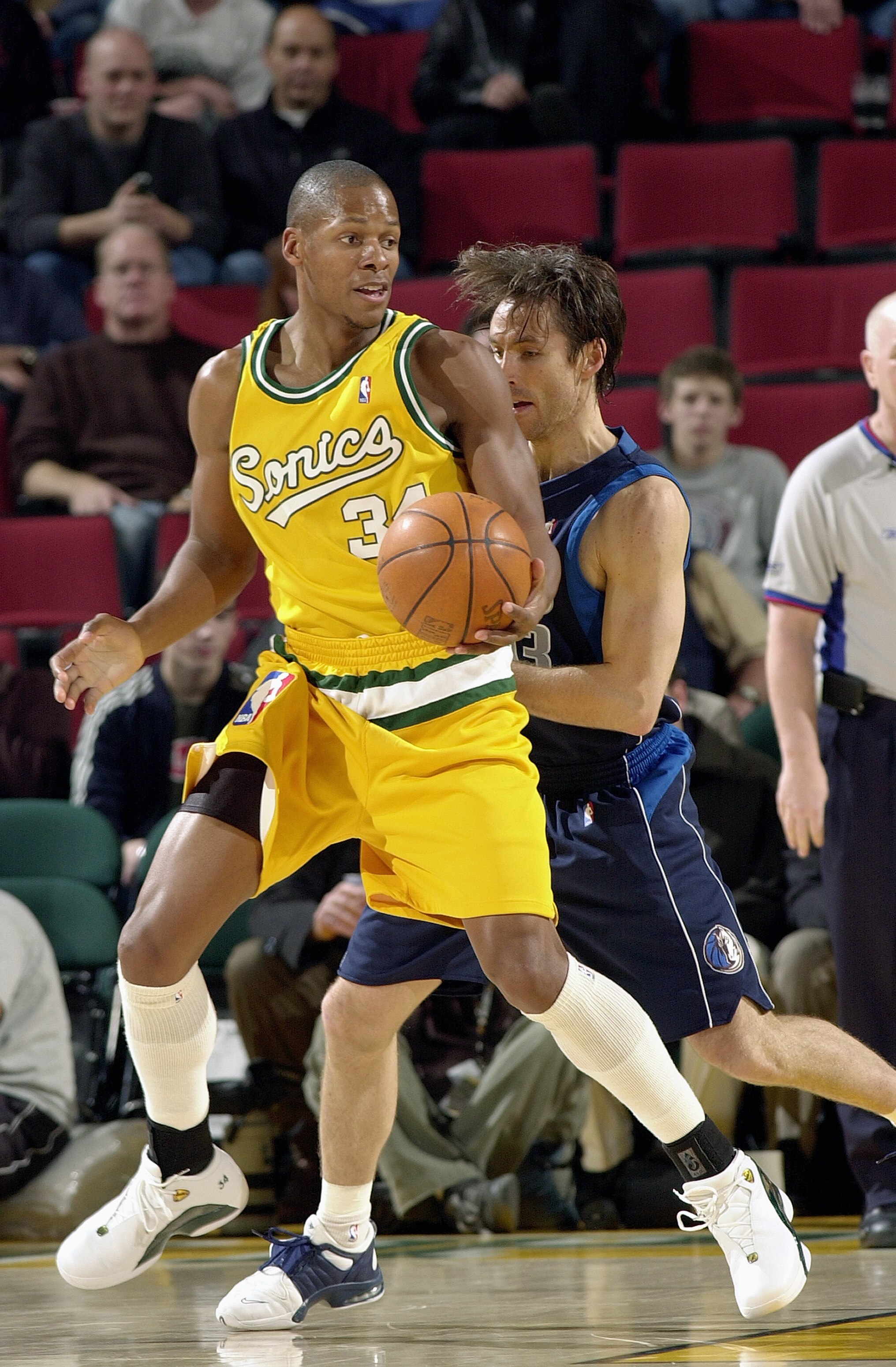 SEATTLE - JANUARY 27:  Ray Allen #34 of the Seattle Sonics posts up Steve Nash #13 of the Dallas Mavericks during the game on January 27, 2004 at Key Arena in Seattle, Washington.  The Mavericks won 118-116.  NOTE TO USER: User expressly acknowledges and