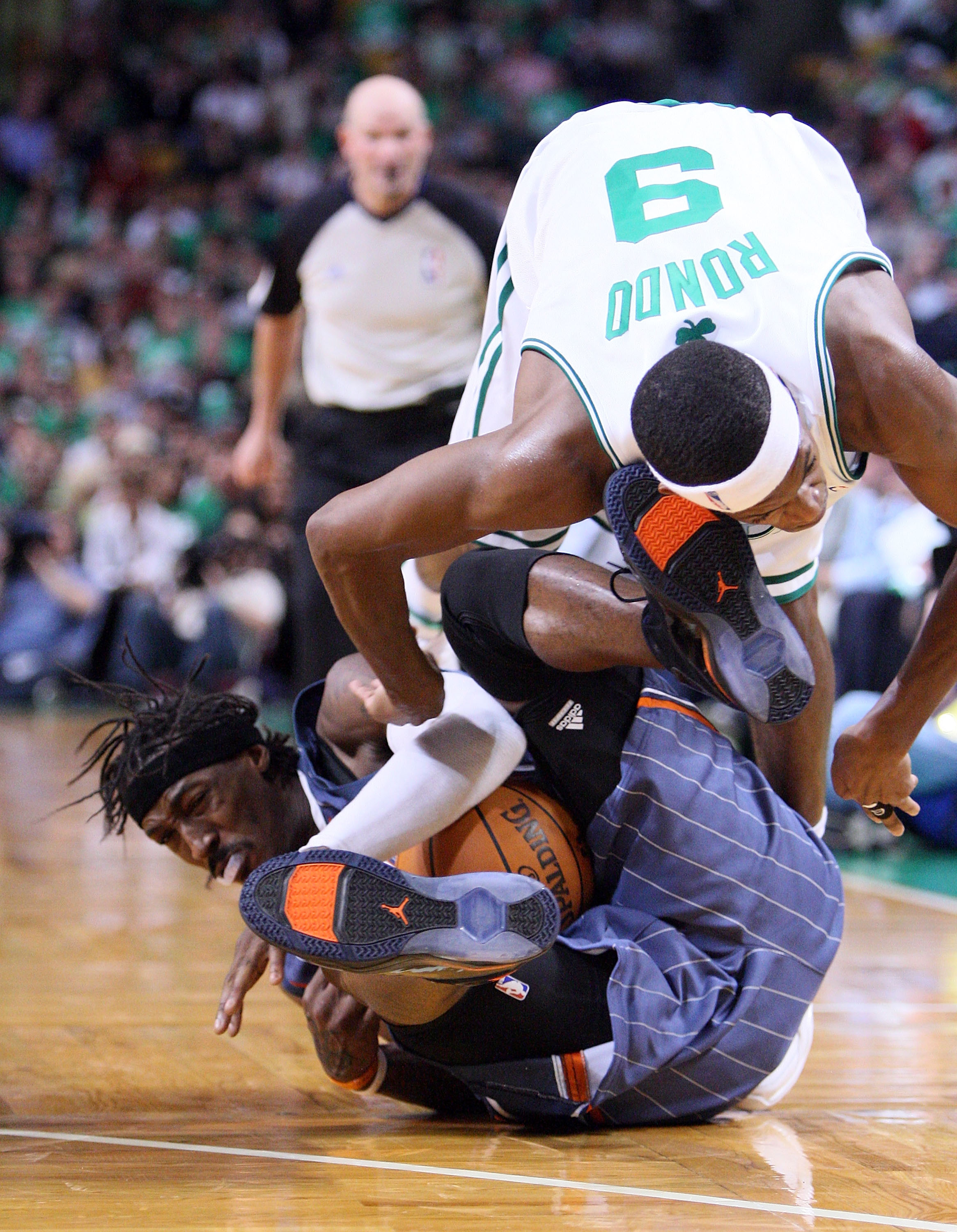 BOSTON, MA - OCTOBER 28:  Gerald Wallace #3 of the Charlotte Bobcats collides with Rajon Rondo #9 of the Boston Celtics at the TD Banknorth Garden on October 28, 2009 in Boston, Massachusetts. NOTE TO USER: User expressly acknowledges and agrees that, by