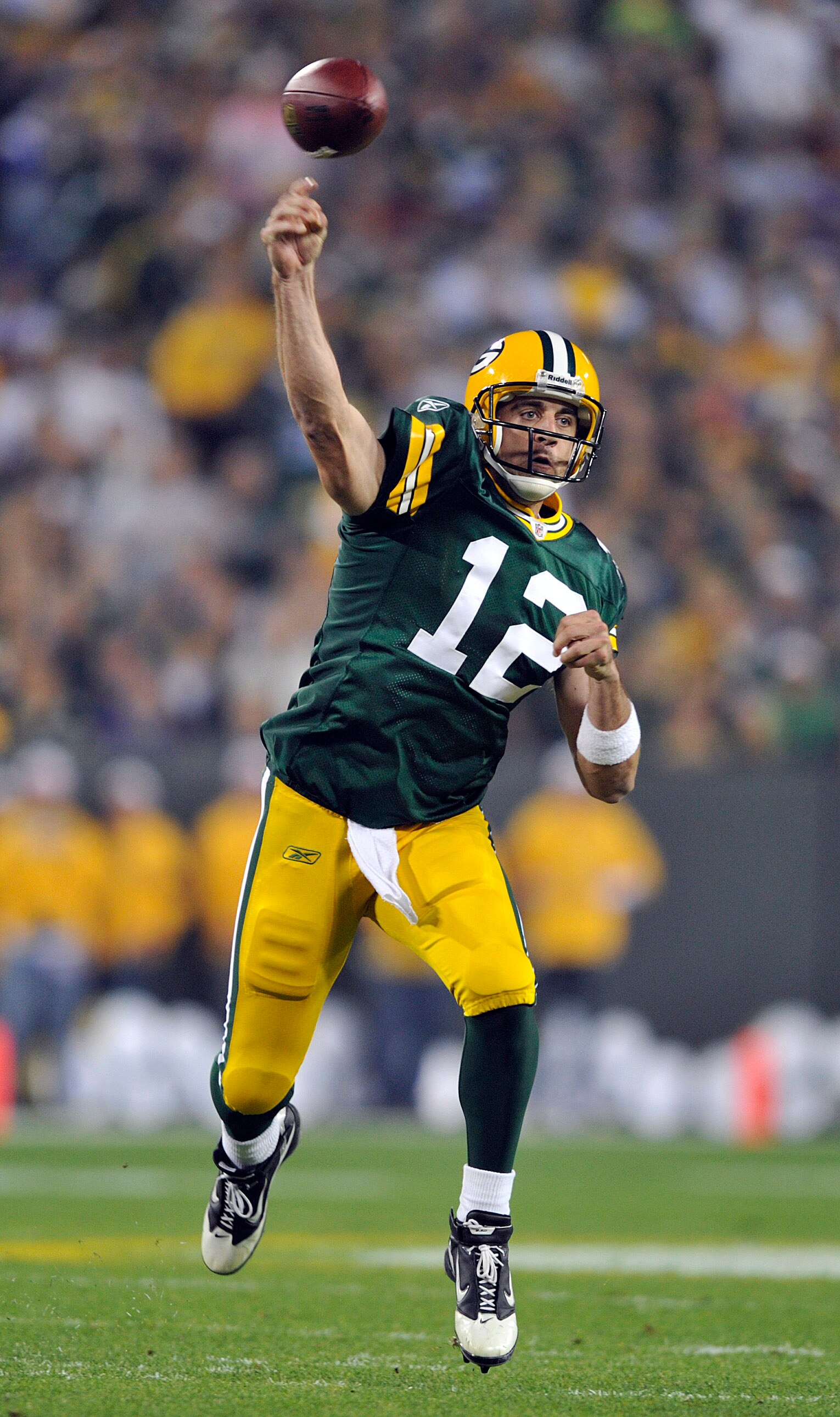 GREEN BAY, WI - OCTOBER 24:  Aaron Rodgers #12 of the Green Bay Packers passes against the Minnesota Vikings at Lambeau Field on October 24, 2010 in Green Bay, Wisconsin. (Photo by Jim Prisching/Getty Images)