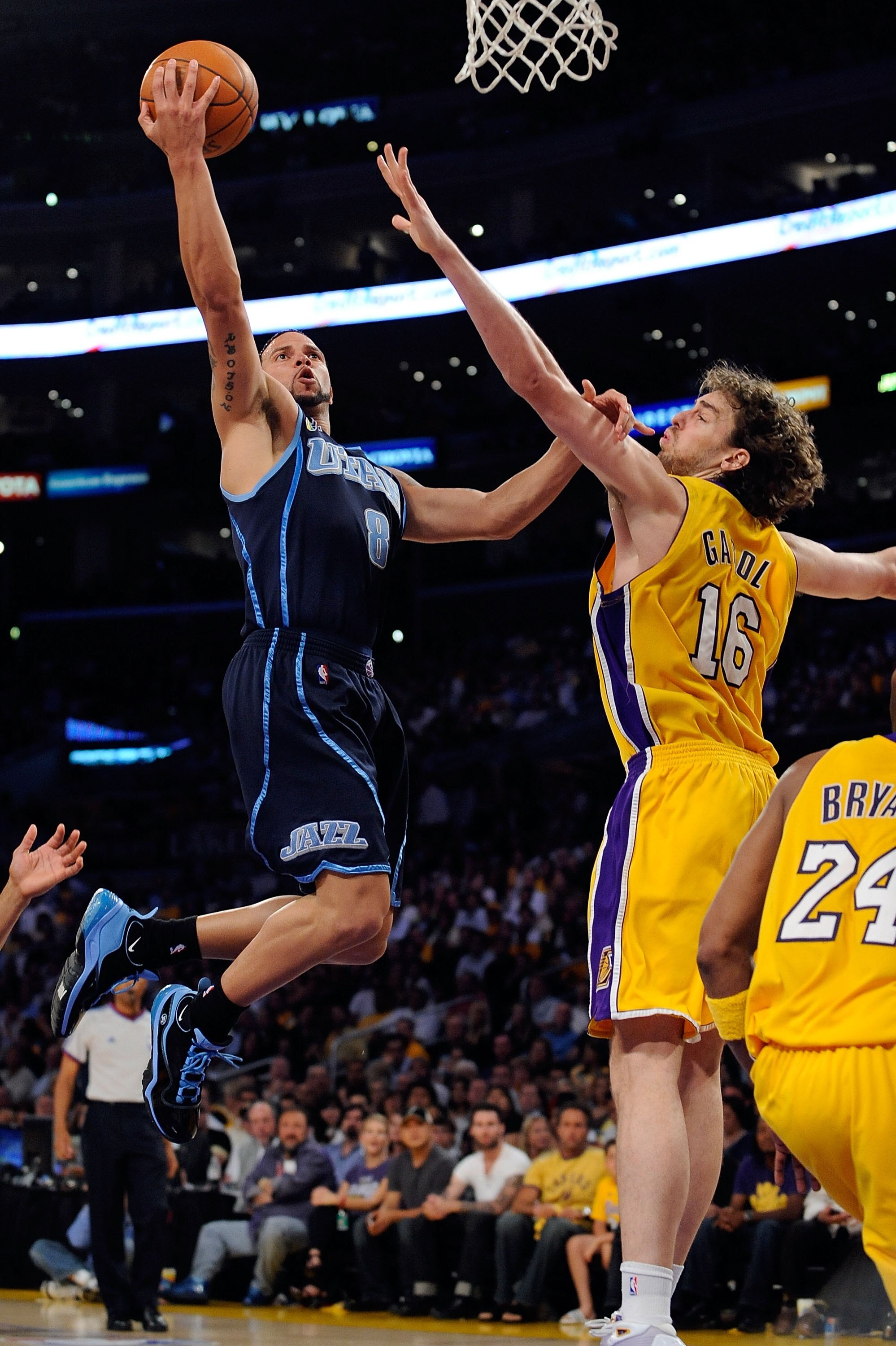 LOS ANGELES, CA - APRIL 21:  Deron Williams #8 of the Utah Jazz goes up for a shot against Pau Gasol #16 of the Los Angeles Lakers in the first half of Game Two of the Western Conference Quarterfinals during the 2009 NBA Playoffs at Staples Center on Apri