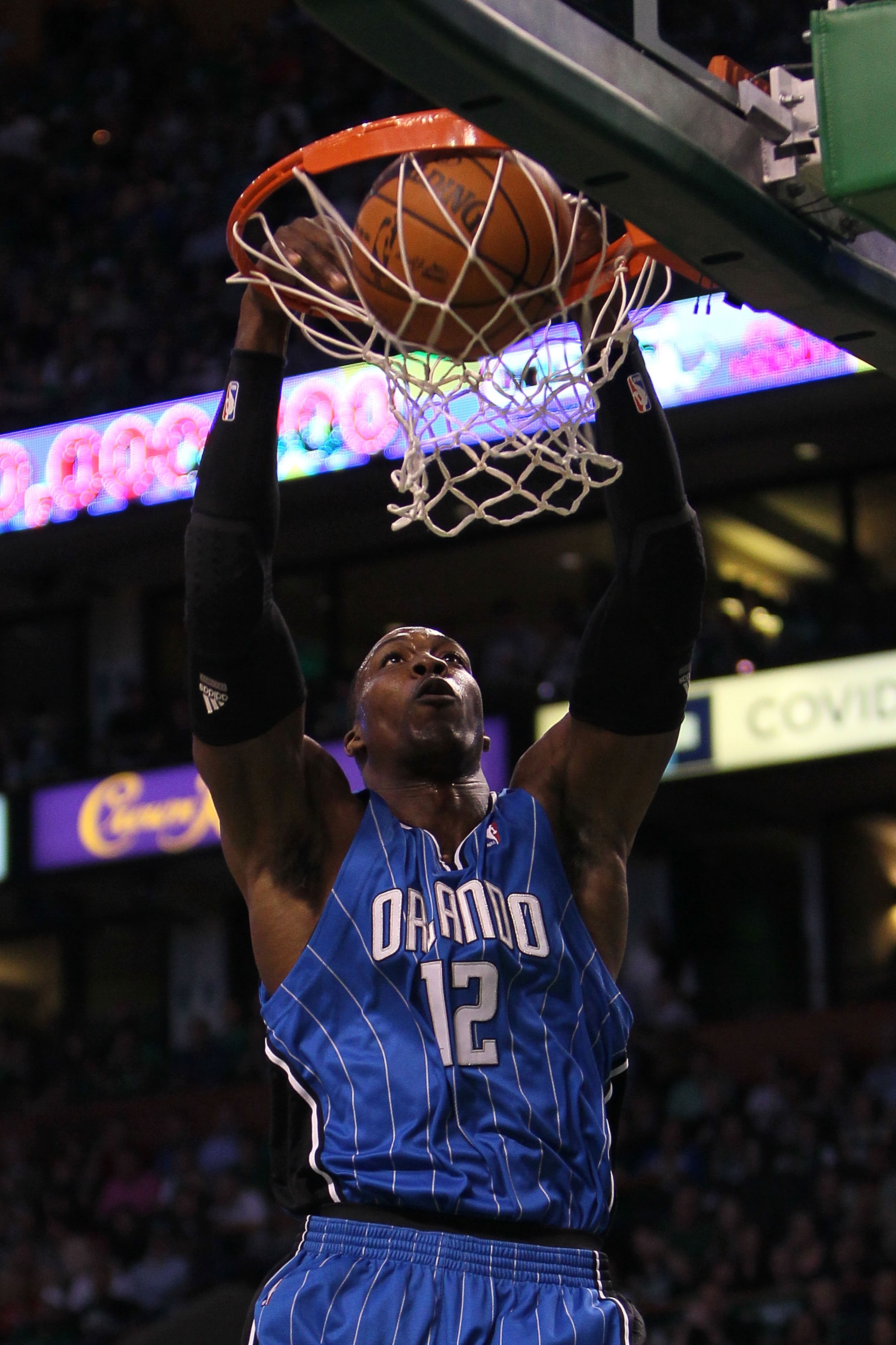 BOSTON - MAY 28: Dwight Howard #12 of the Orlando Magic dunks against the Boston Celtics in Game Six of the Eastern Conference Finals during the 2010 NBA Playoffs at TD Garden on May 28, 2010 in Boston, Massachusetts. NOTE TO USER: User expressly ackno BOSTON - MAY 28: Dwight Howard #12 of the Orlando Magic dunks against the Boston Celtics in Game Six of the Eastern Conference Finals during the 2010 NBA Playoffs at TD Garden on May 28, 2010 in Boston, Massachusetts. NOTE TO USER: User expressly ackno