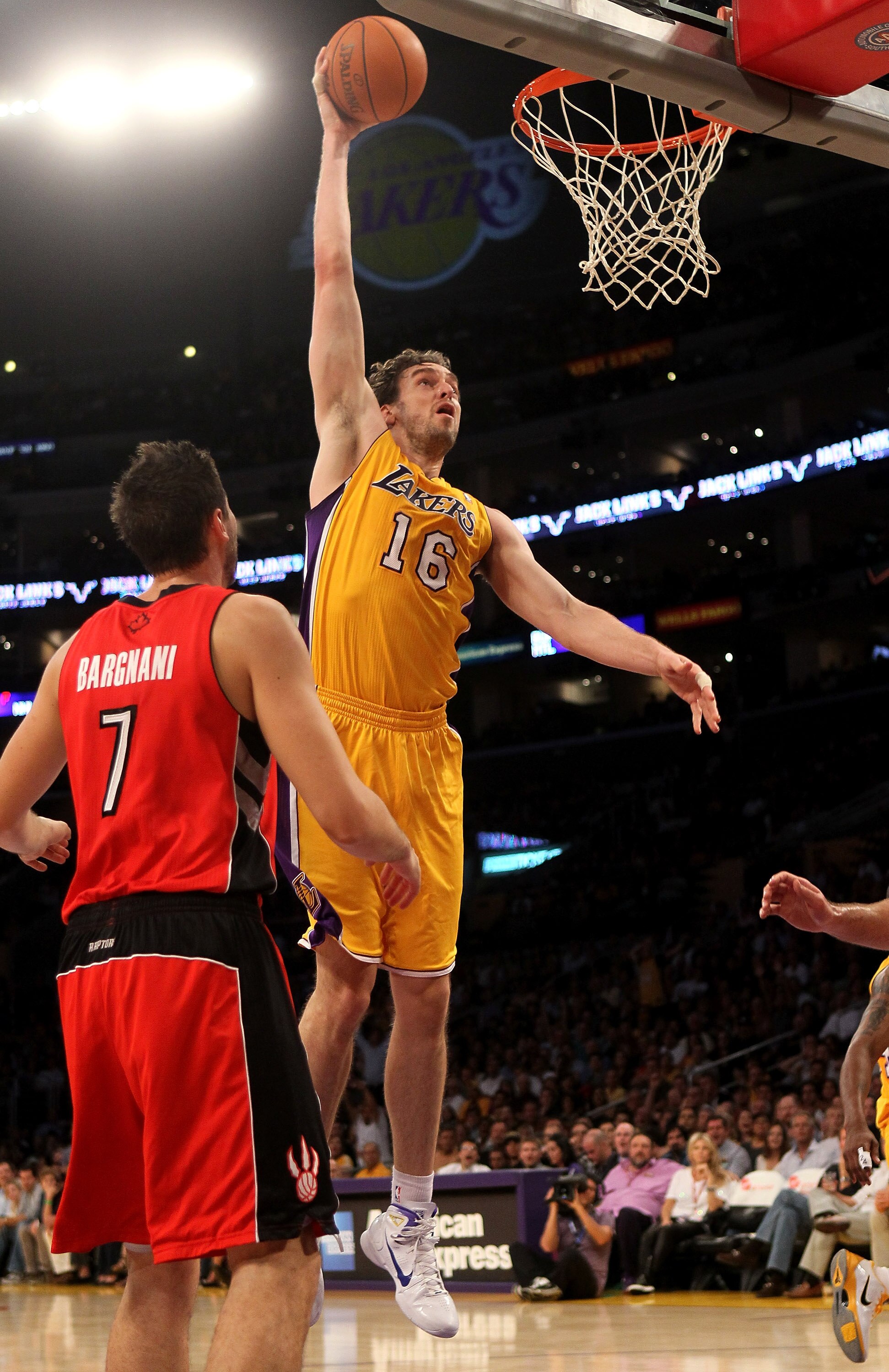 LOS ANGELES, CA - NOVEMBER 05: Pau Gasol #16 of the Los Angeles Lakers shoots over Andrea Bargnani #7 of the Toronto Raptors at Staples Center on November 5, 2010 in Los Angeles, California.   NOTE TO USER: User expressly acknowledges and agrees that, by