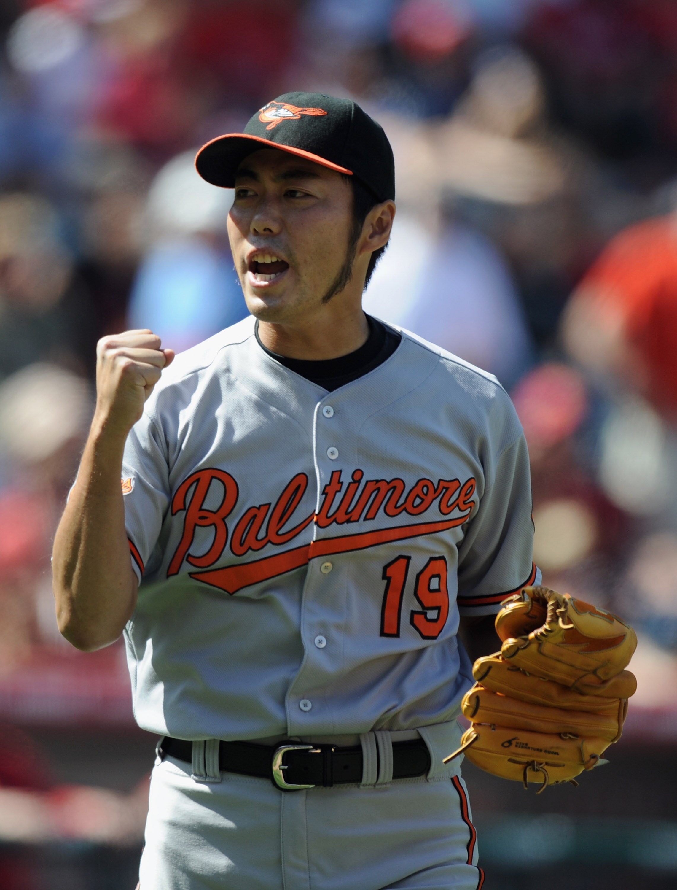 ANAHEIM, CA - AUGUST 29:  Koji Uehara #19 of the Baltimore Orioles celebrates a save and a 1-0 win over the Los Angeles Angels of Anaheim during the ninth inning at Angel Stadium on August 29, 2010 in Anaheim, California.  (Photo by Harry How/Getty Images