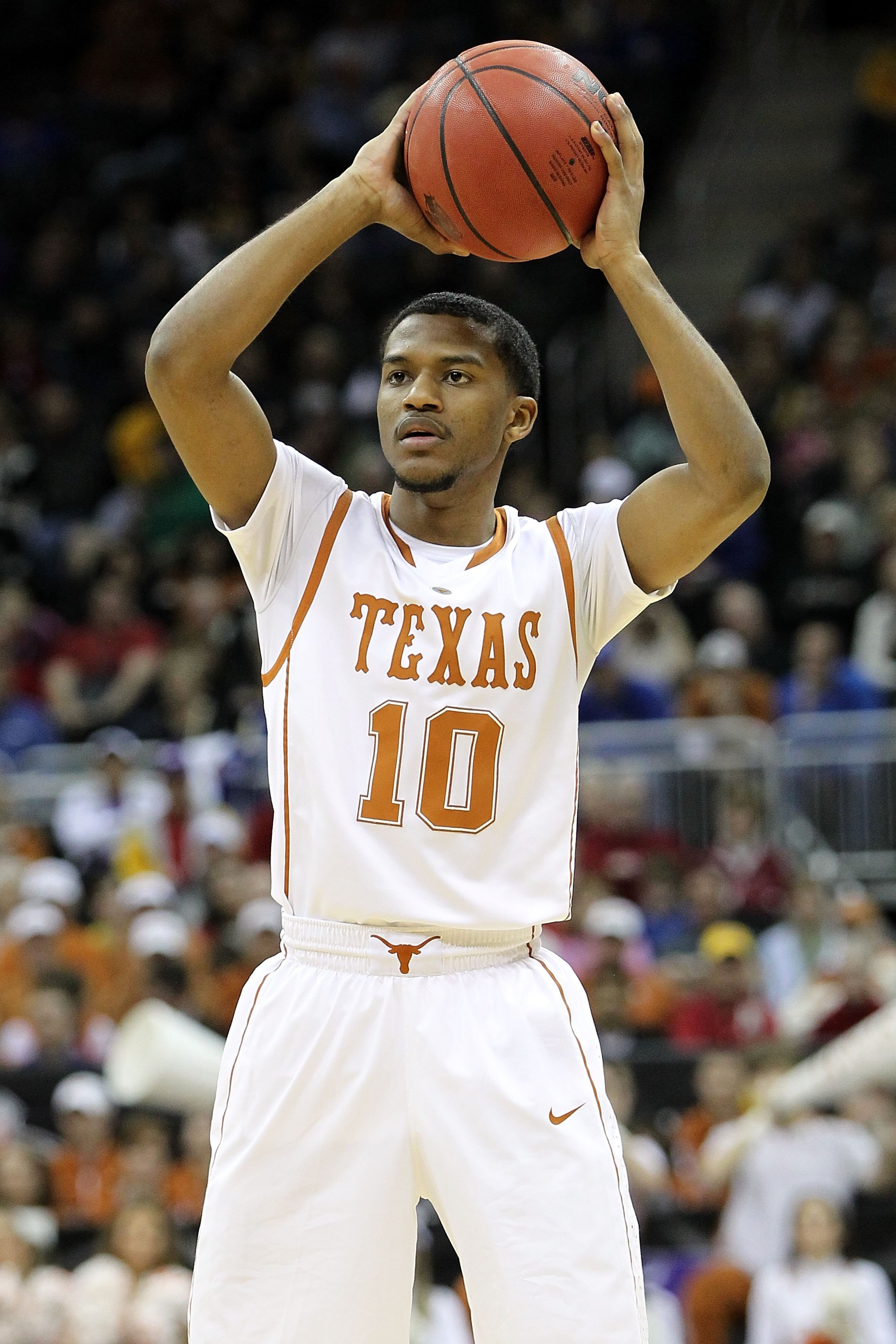 KANSAS CITY, MO - MARCH 10:  Jai Lucas #10 of the Texas Longhorns looks to pass the ball against the Iowa State Cyclones during the first round game of the 2010 Phillips 66 Big 12 Men's Basketball Tournament at the Sprint Center on March 10, 2010 in Kansa