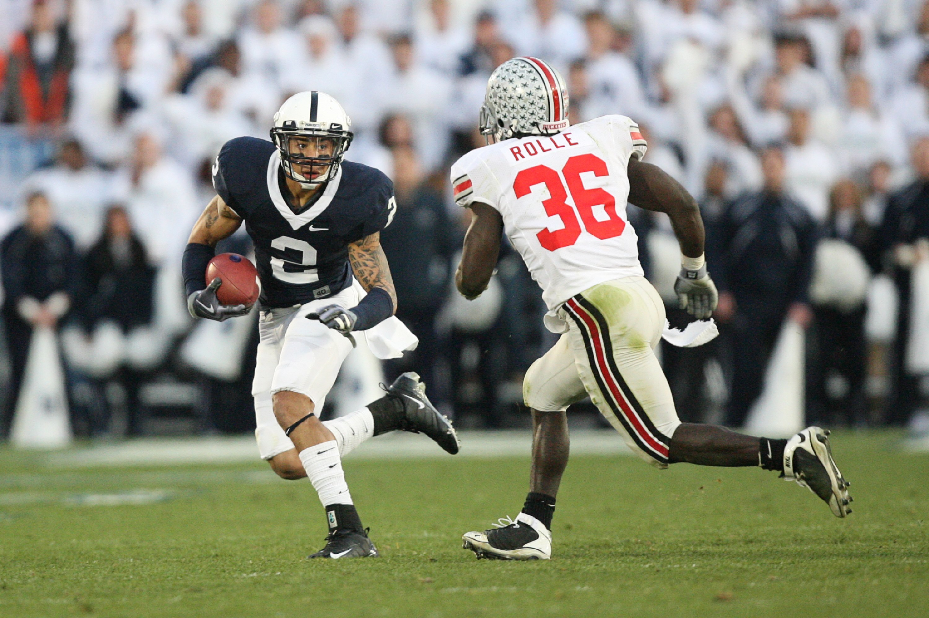 STATE COLLEGE, PA - NOVEMBER 7: Wide receiver Chaz Powell #2 of the Penn State Nittany Lions runs with the ball as linebacker Brian Rolle #36 of the Ohio State Buckeyes pursues during a game on November 7, 2009 at Beaver Stadium in State College, Pennsylv