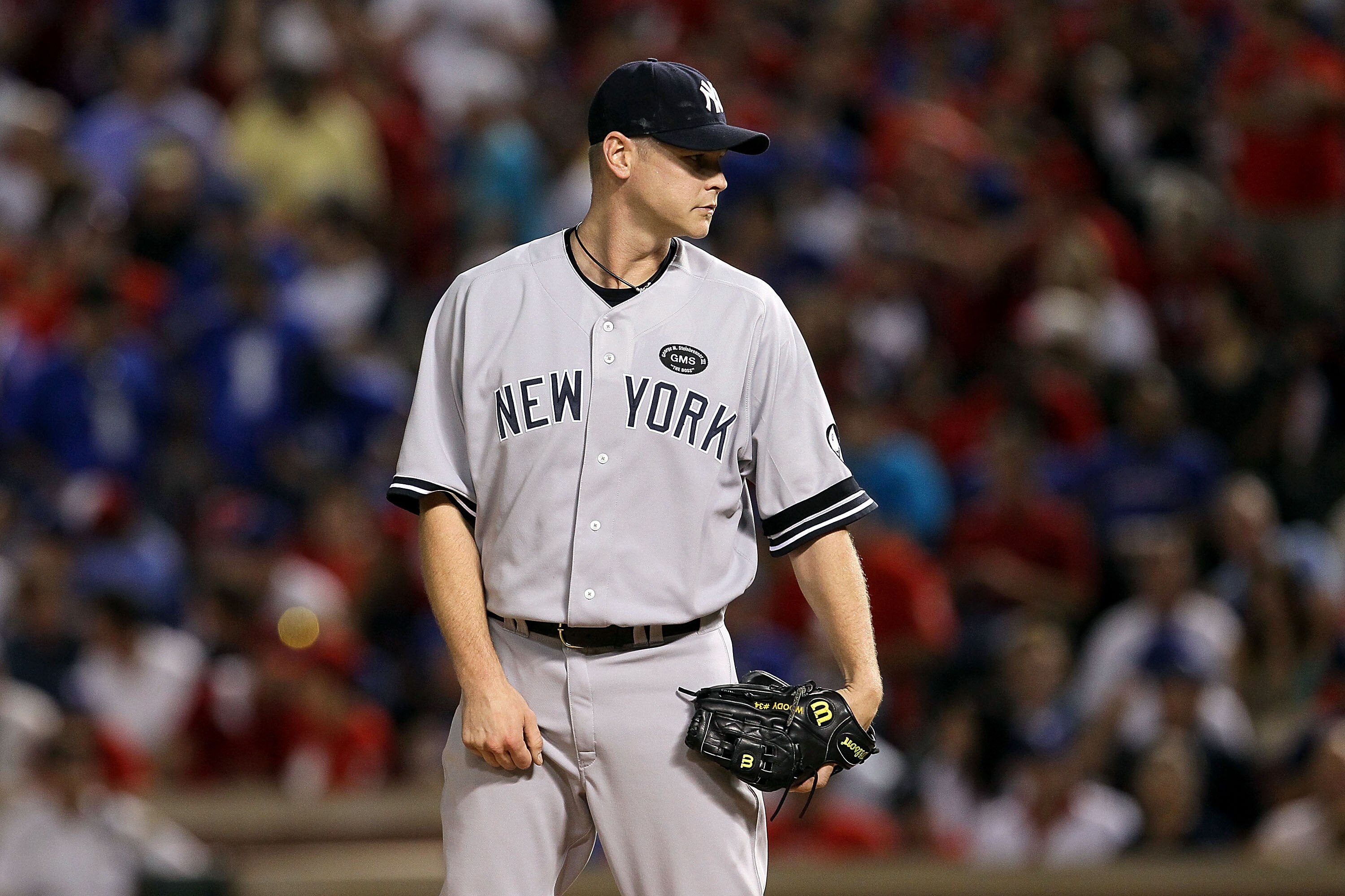 ARLINGTON, TX - OCTOBER 22:  Kerry Wood #39 of the New York Yankees gets set to throw a pitch against the Texas Rangers in Game Six of the ALCS during the 2010 MLB Playoffs at Rangers Ballpark in Arlington on October 22, 2010 in Arlington, Texas. The Rang