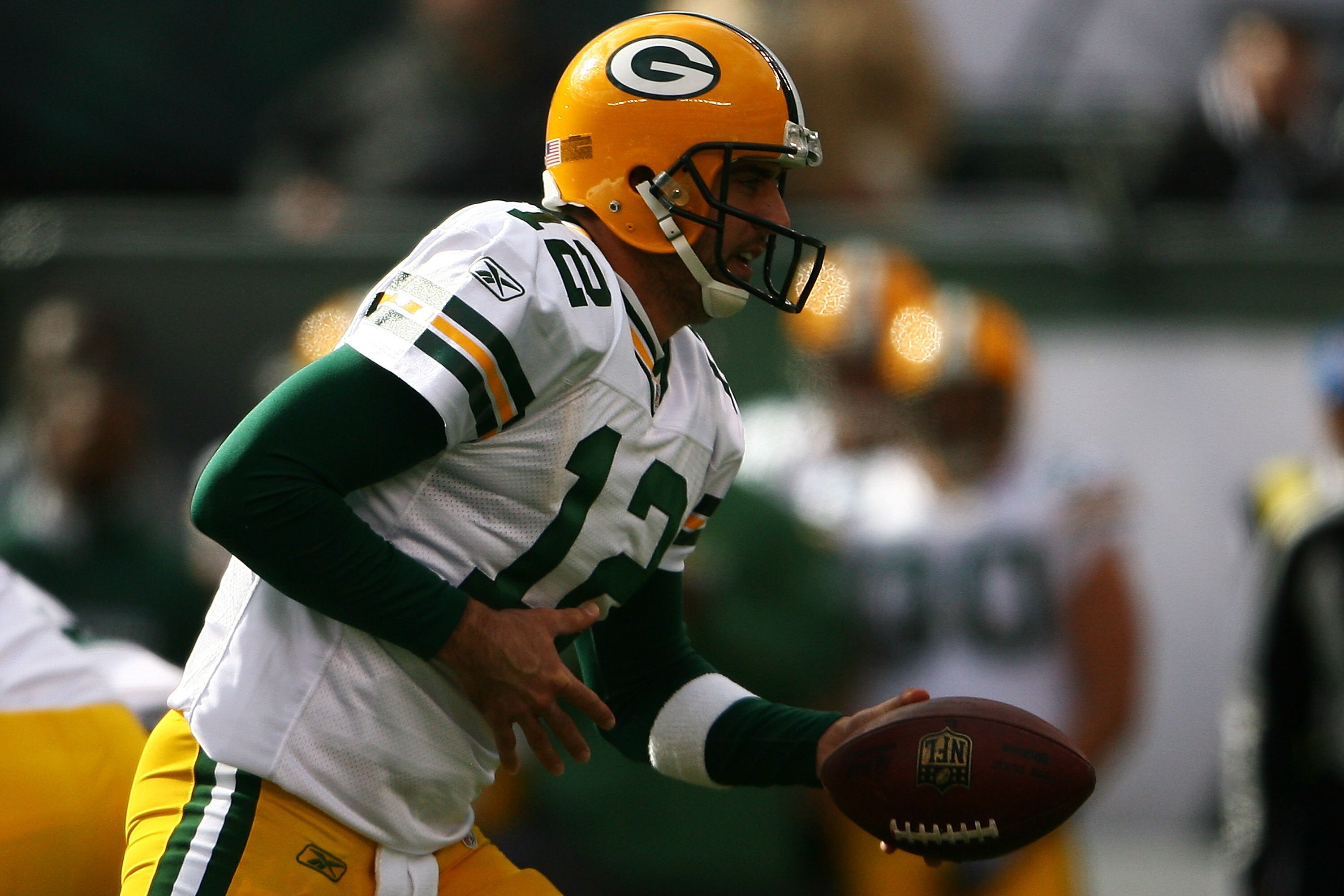 EAST RUTHERFORD, NJ - OCTOBER 31: Aaron Rodgers #12 of the Green Bay Packers hands off the ball during a game against the New York Jets on October 31, 2010 at the New Meadowlands Stadium in East Rutherford, New Jersey.  (Photo by Andrew Burton/Getty Image