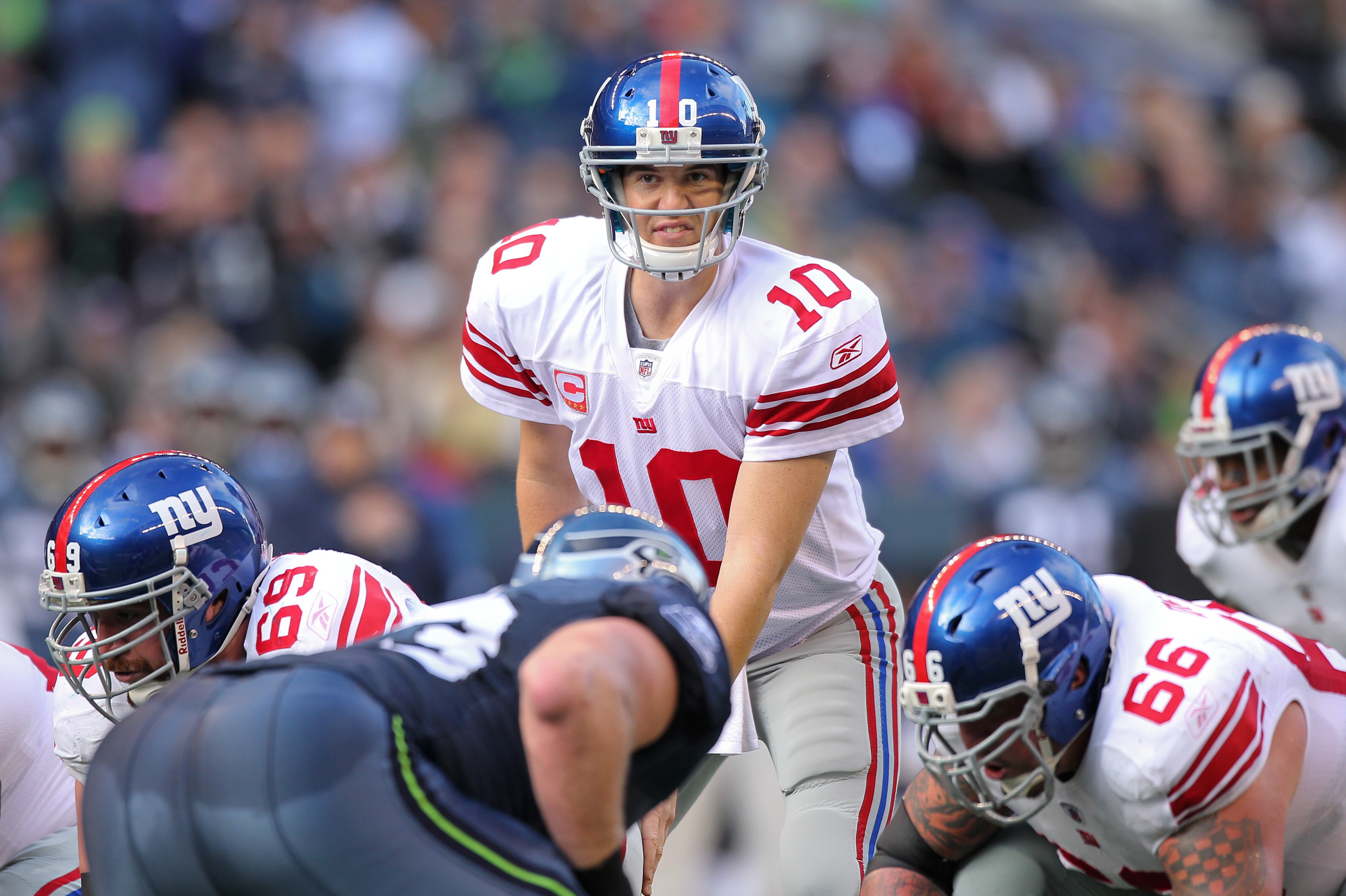 SEATTLE - NOVEMBER 07:  Quarterback Eli Manning #10 of the New York Giants looks over the defense at the line of scrimmage against the Seattle Seahawks at Qwest Field on November 7, 2010 in Seattle, Washington. The Giants defeated the Seahawks 41-7. (Phot