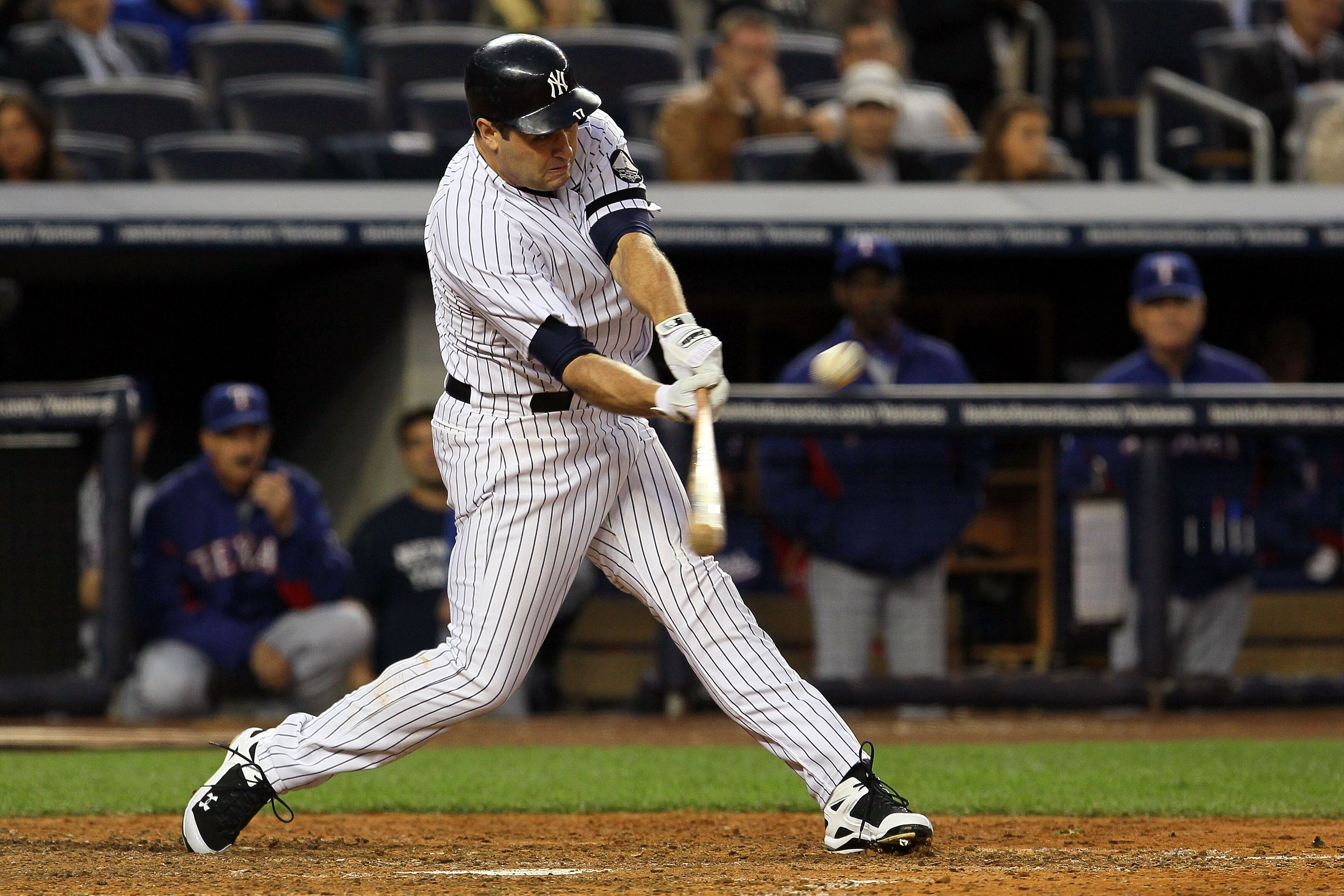 NEW YORK - OCTOBER 20:  Lance Berkman #17 of the New York Yankees hits a RBI sacrafice fly in the bottom of the fifth inning against the Texas Rangers in Game Five of the ALCS during the 2010 MLB Playoffs at Yankee Stadium on October 20, 2010 in the Bronx
