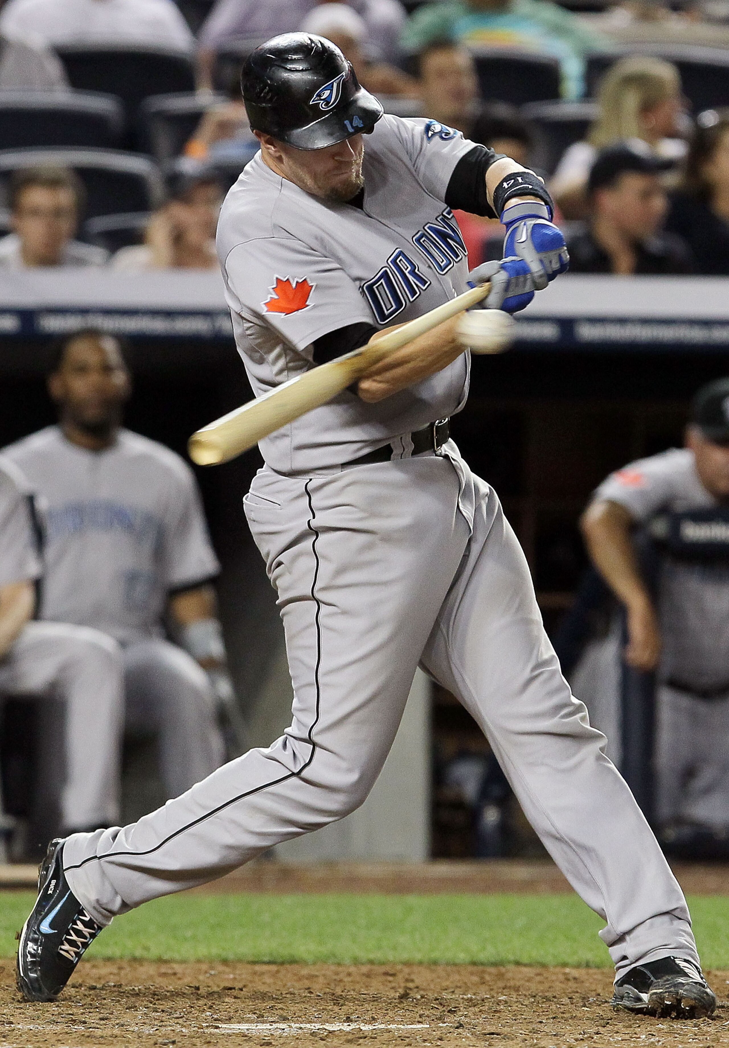 NEW YORK - AUGUST 03:  John Buck #14 of the Toronto Blue Jays bats against of the New York Yankees on August 3, 2010 at Yankee Stadium in the Bronx borough of New York City. The Jays defeated the Yankees 8-2.  (Photo by Jim McIsaac/Getty Images)