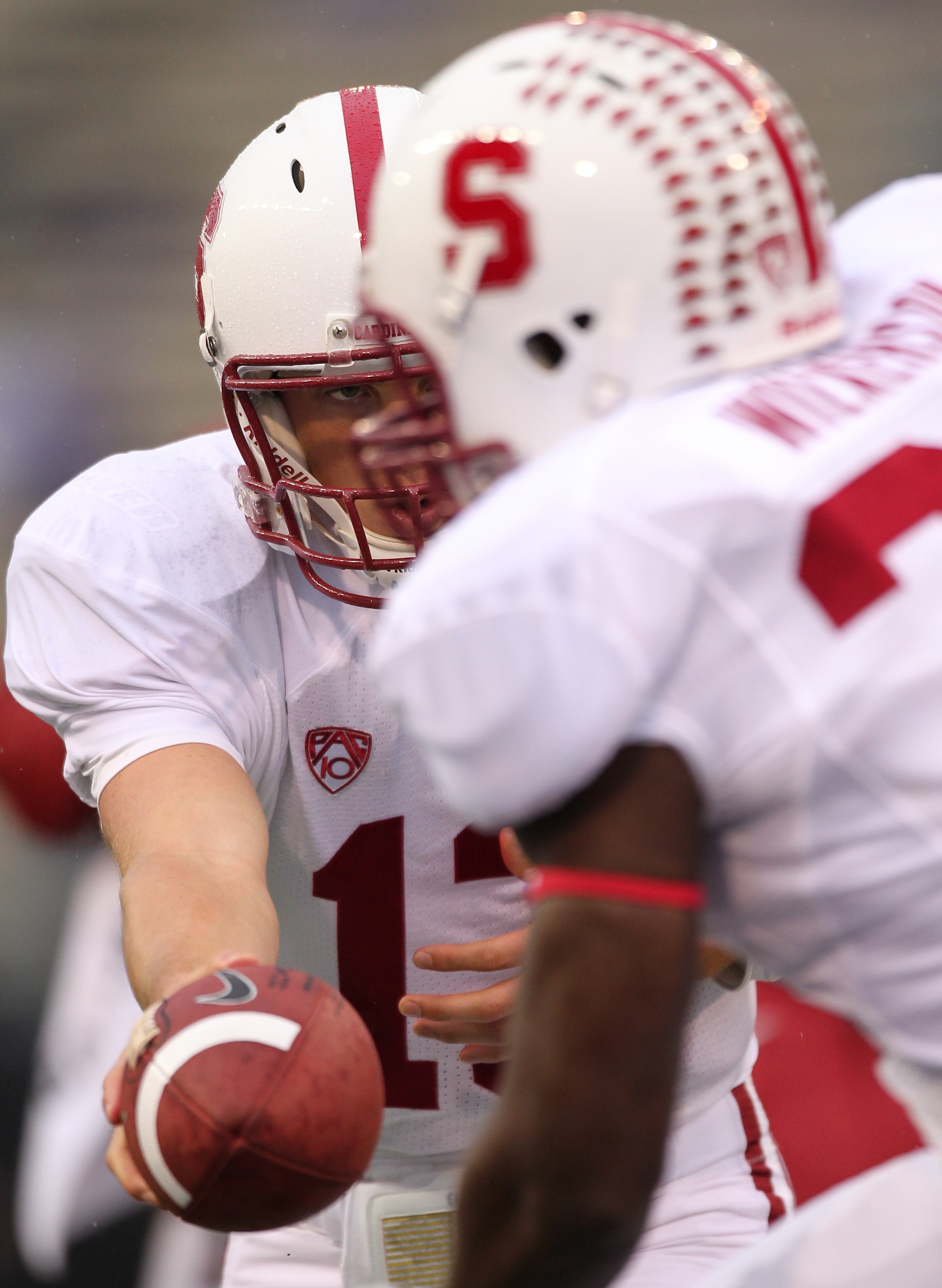 SEATTLE - OCTOBER 30:  Quarterback Robbie Picazo #13 of the Stanford Cardinal hands off to Anthony Wilkerson #32 during warm ups prior to the game  against the Washington Huskies on October 30, 2010 at Husky Stadium in Seattle, Washington. Stanford won 41