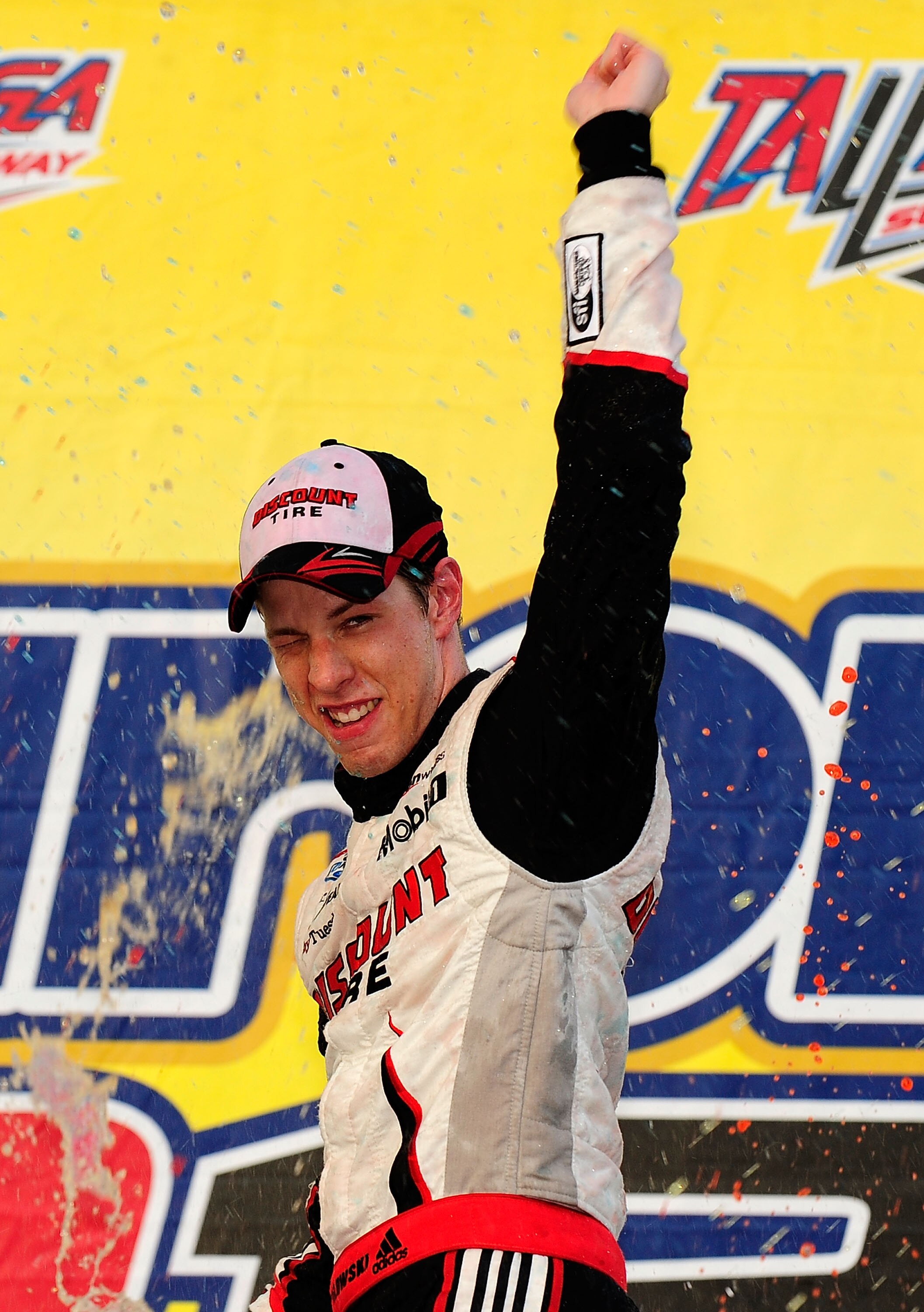 TALLADEGA, AL - APRIL 25:  Brad Keselowski, driver of the #22 Discount Tire Dodge, celebrates in Victory Lane after winning the NASCAR Nationwide Series Aaron's 312 at Talladega Superspeedway on April 25, 2010 in Talladega, Alabama.  (Photo by Rusty Jarre