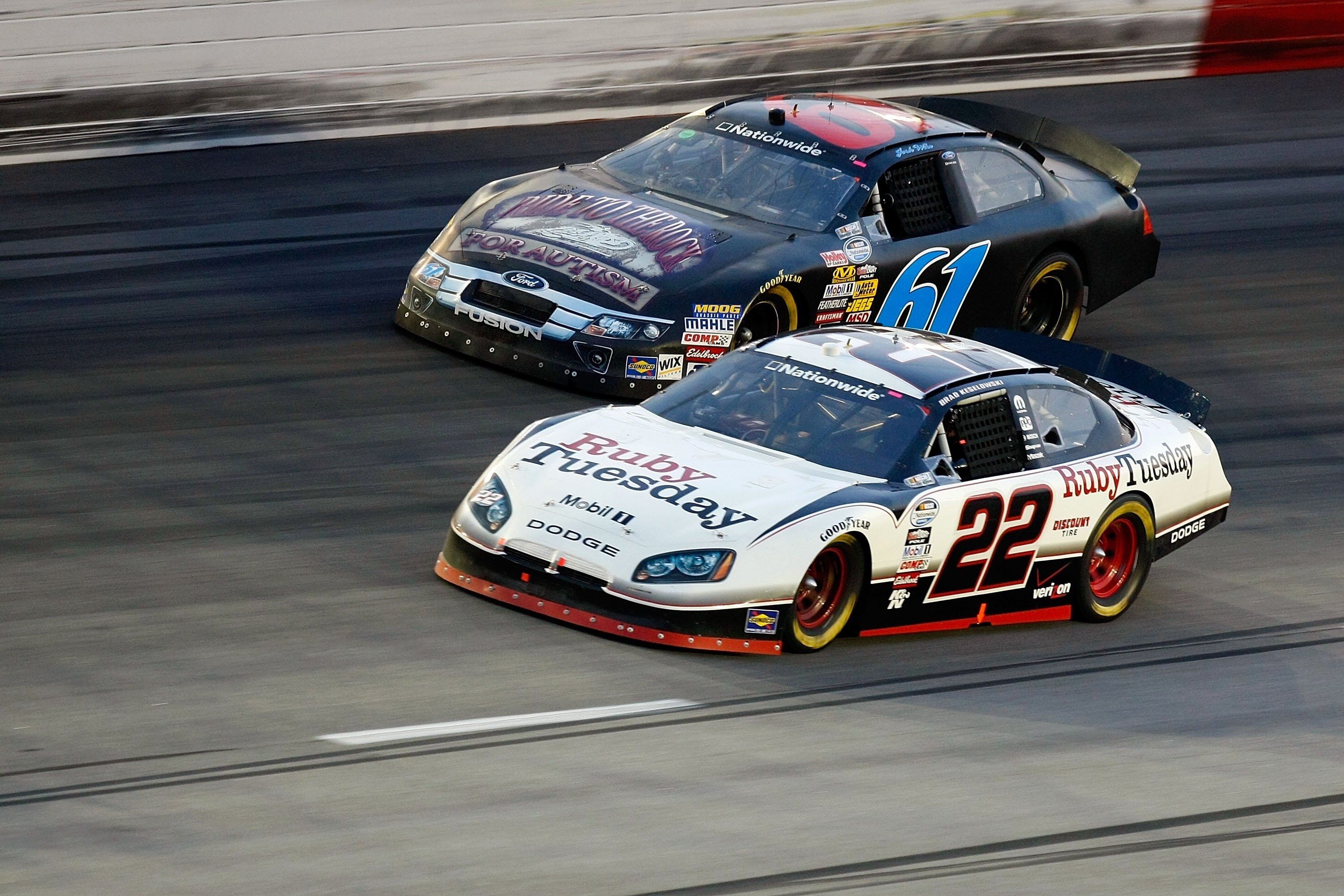 DARLINGTON, SC - MAY 07:  Brad Keselowski, driver of the #22 Ruby Tuesday Dodge, leads  Josh Wise, driver of the #61 Ride to the Rock for Autism Ford, during the NASCAR Nationwide series Royal Purple 200 presented by O'Reilly Auto Parts at Darlington Race