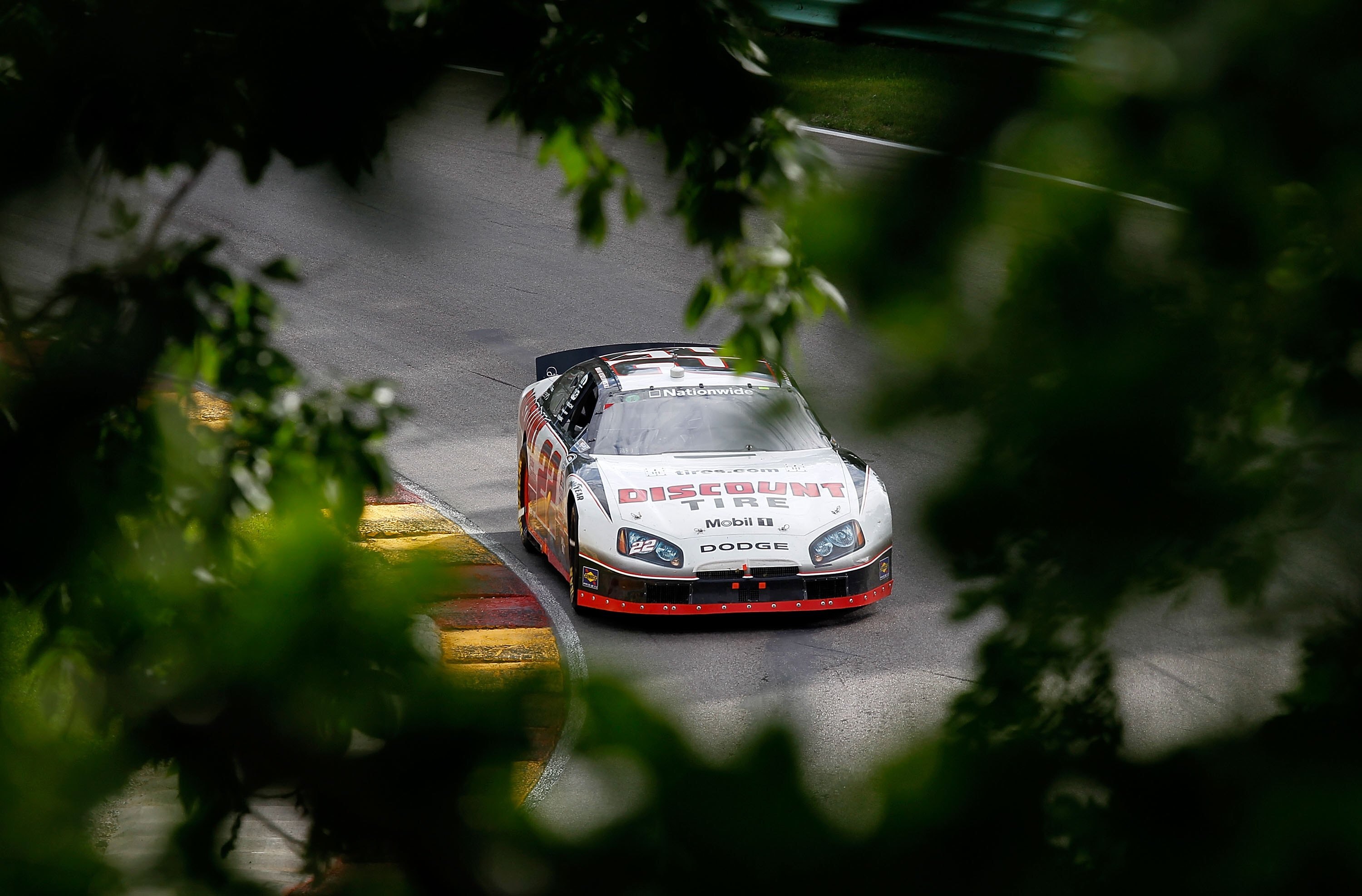 ELKHART LAKE, WI - JUNE 19: Brad Keselowski, driving the #22 Discount Tire Dodge, moves through a turn during the NASCAR Nationwide Series Bucyrus 200 at Road America on June 19, 2010 in Elkhart Lake, Wisconsin. (Photo by Jonathan Daniel/Getty Images)
