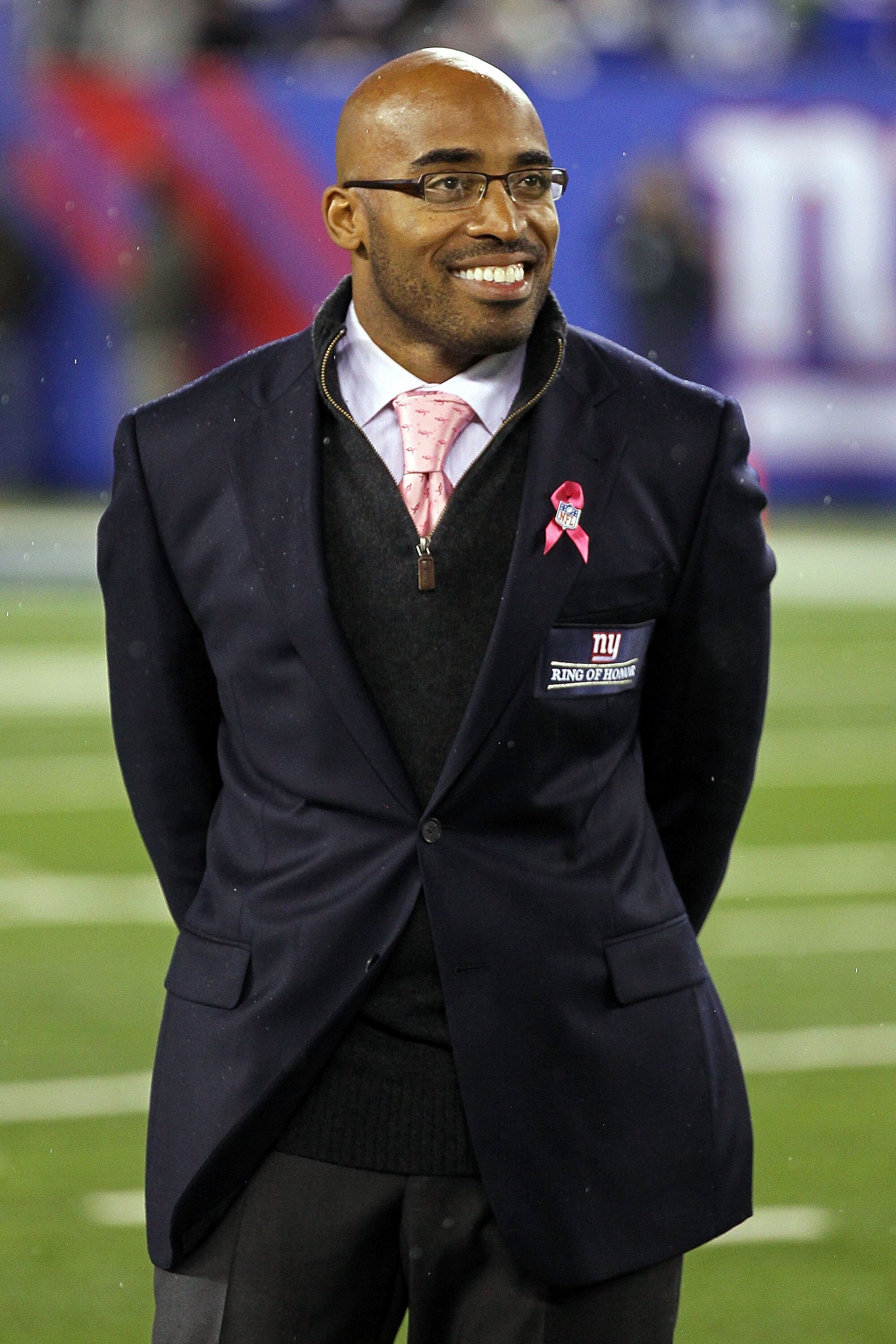 EAST RUTHERFORD, NJ - OCTOBER 03:  Former New York Giants Tiki Barber is inducted into the Giants ï¿½Ring of Honorï¿½ during halftime of a game between the Chicago Bears and the New York Giants at New Meadowlands Stadium on October 3, 2010 in East Rutherford,
