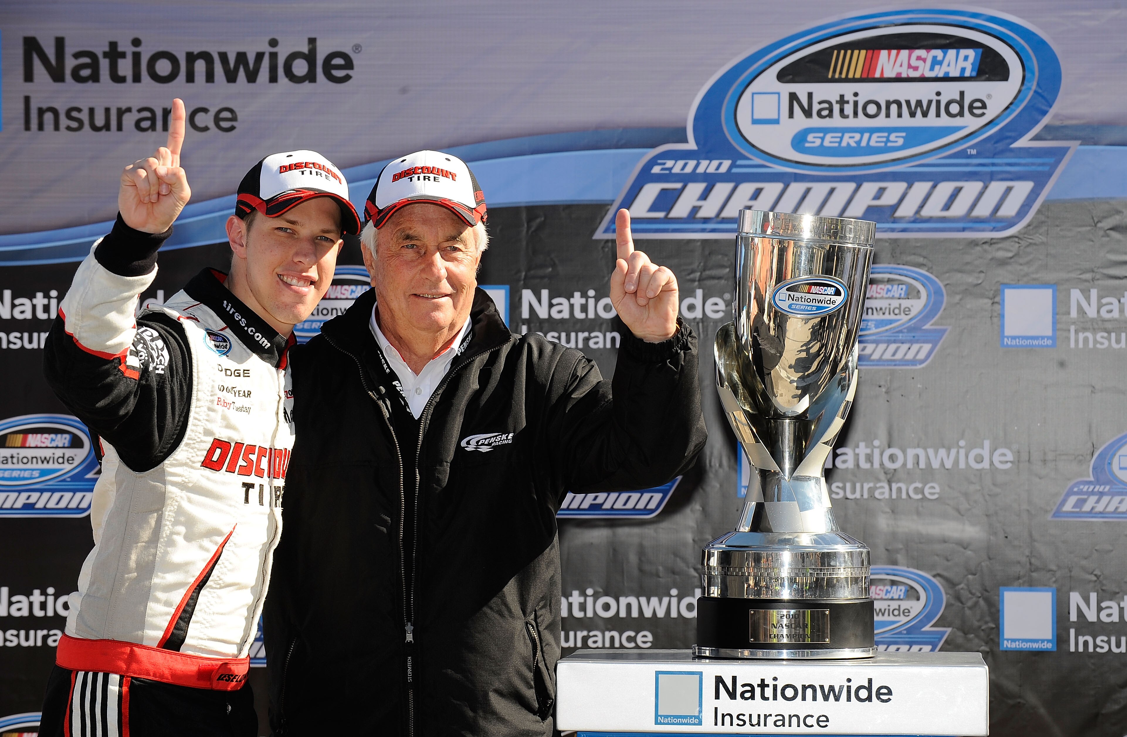 FORT WORTH, TX - NOVEMBER 06:  Brad Keselowski, driver of the #22 Discount Tire Dodge, celebrates with Team Owner Roger Penske on pit road after winning the Nationwide Championship with a third-place finish in the NASCAR Nationwide Series O'Reilly Auto Pa