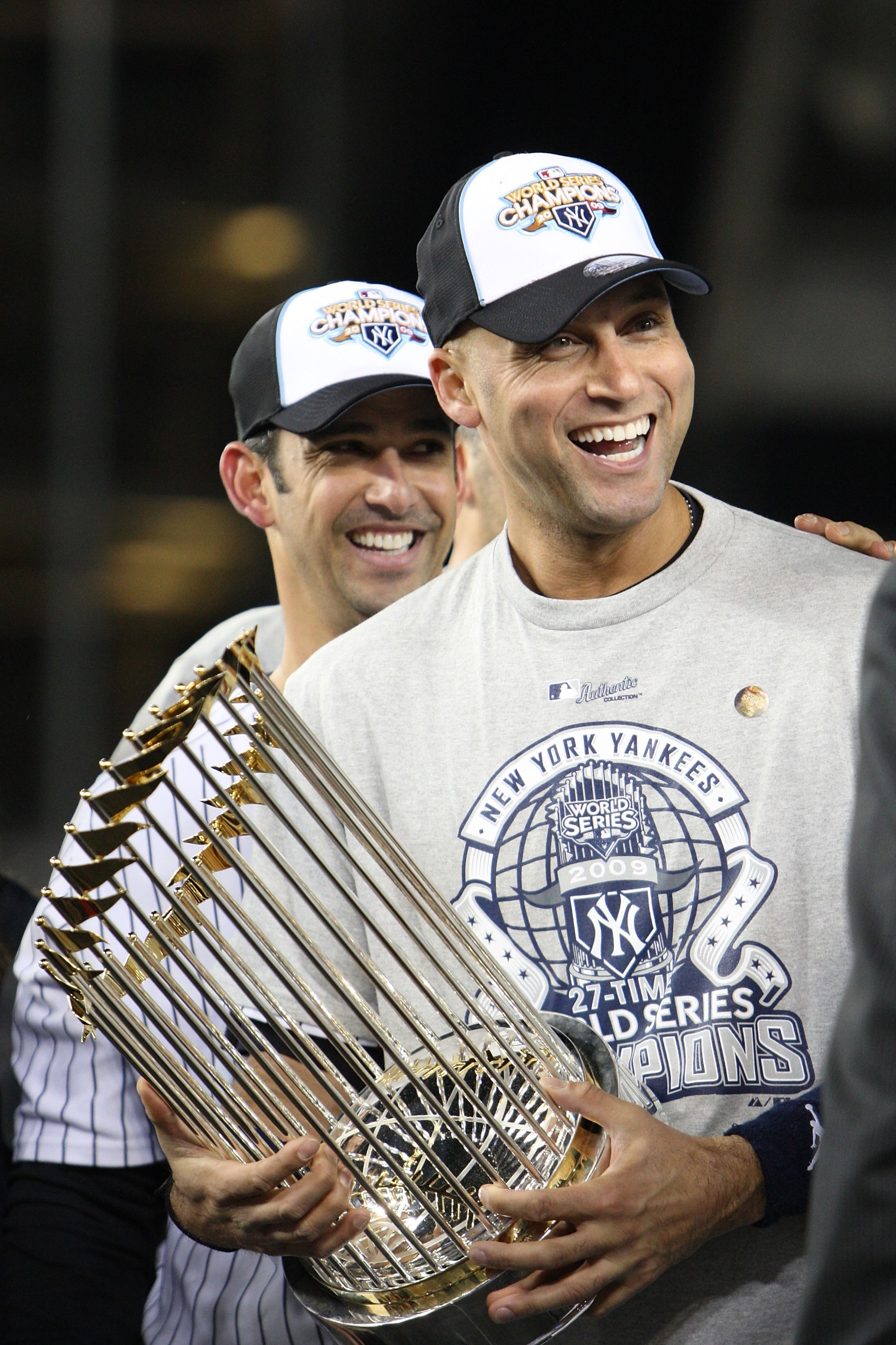NEW YORK - NOVEMBER 04:  Derek Jeter #2 of the New York Yankees celebrates with the trophy after their 7-3 win against the Philadelphia Phillies in Game Six of the 2009 MLB World Series at Yankee Stadium on November 4, 2009 in the Bronx borough of New Yor