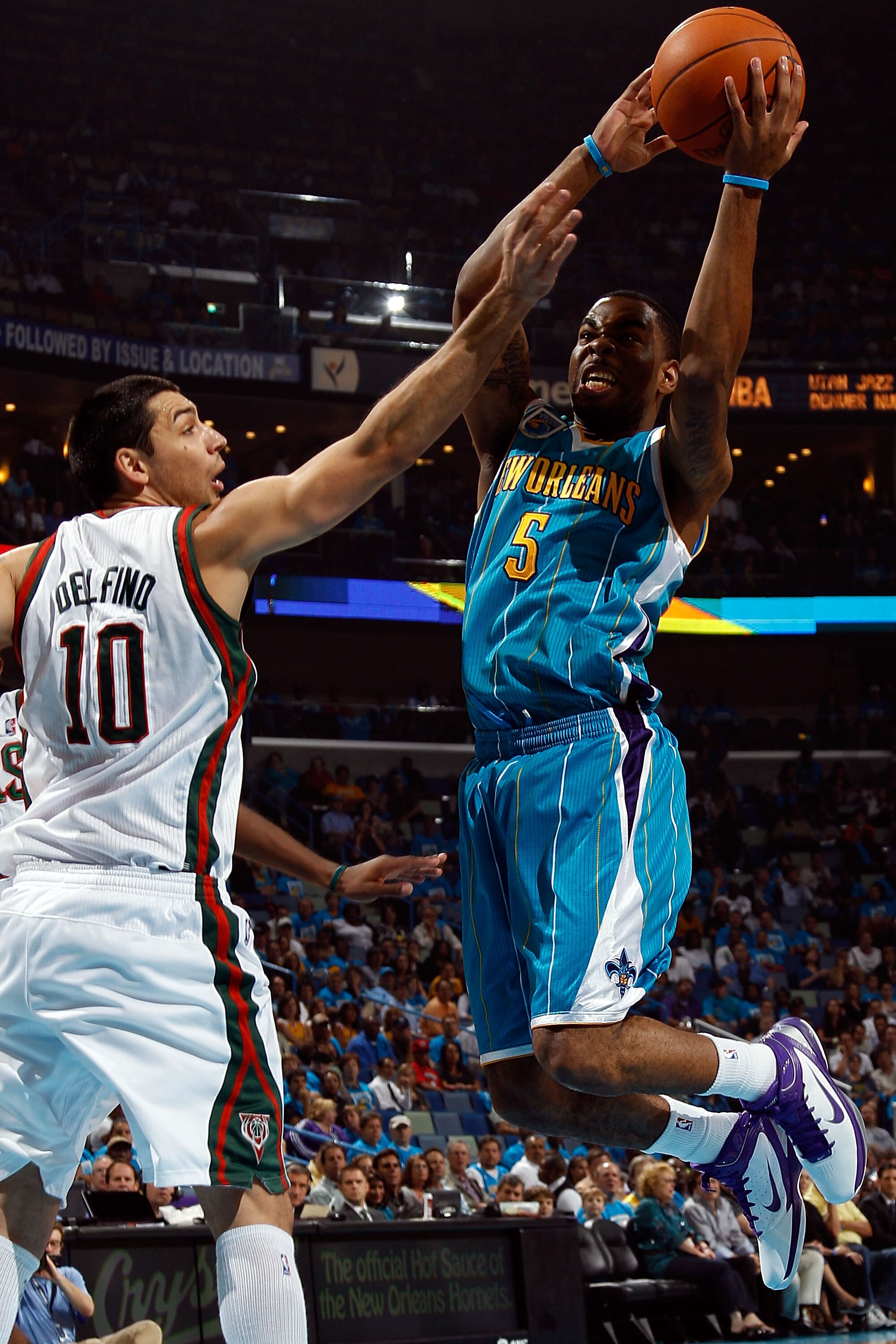 NEW ORLEANS - OCTOBER 27:  Marcus Thornton #5 of the New Orleans Hornets shoots the ball over Carlos Delfino #10 of the Milwaukee Bucks at the New Orleans Arena on October 27, 2010 in New Orleans, Louisiana.  NOTE TO USER: User expressly acknowledges and