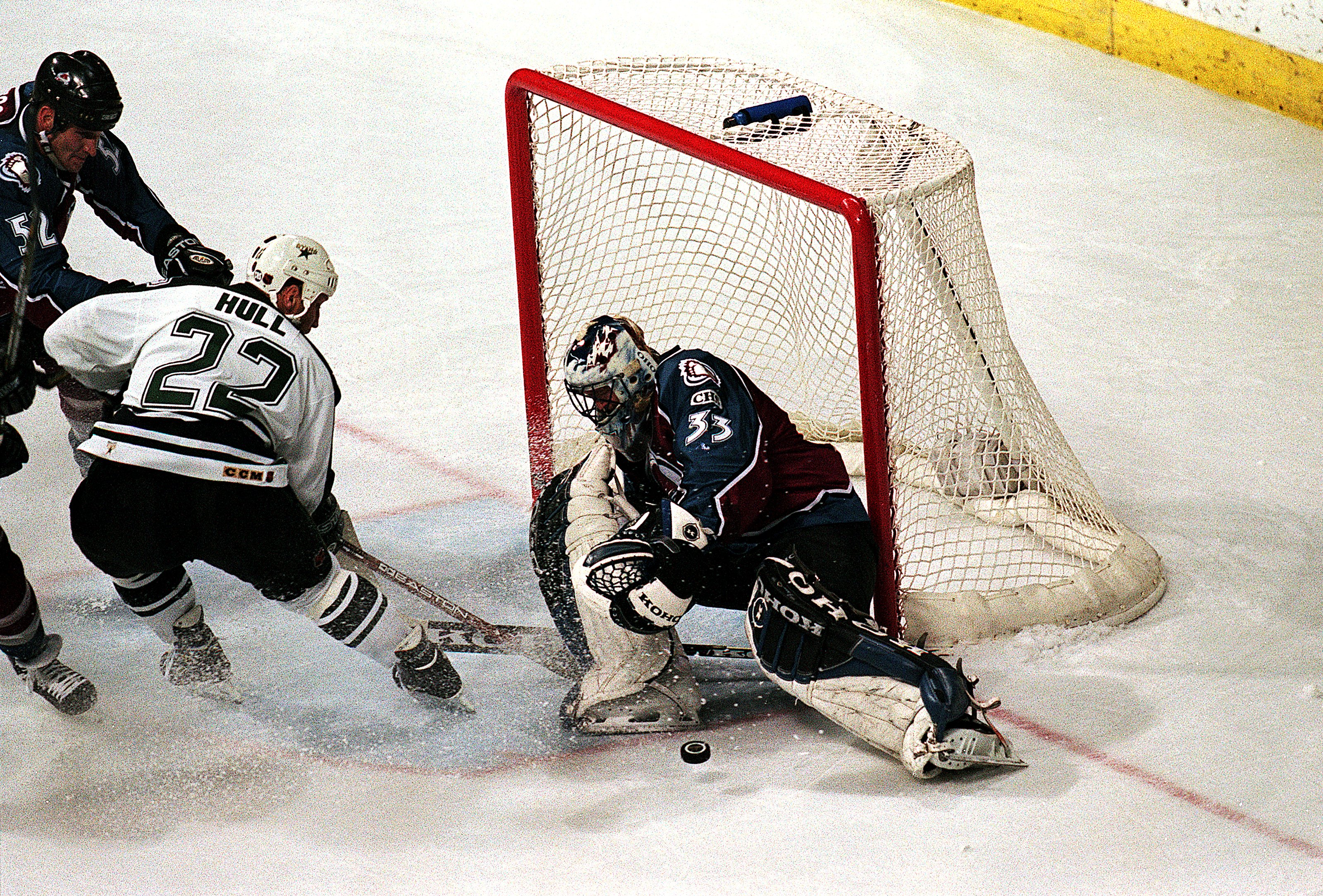 24 May 1999: Patrick Roy #33 of the Colorado Avalanche blocks the puck as Brett Hull #22 of the Dallas Stars tries to score during the Western Conference Finals at the Reunion Arena in Dallas, Texas. The Stars defeated the Avalanche 4-2. Mandatory Credit: