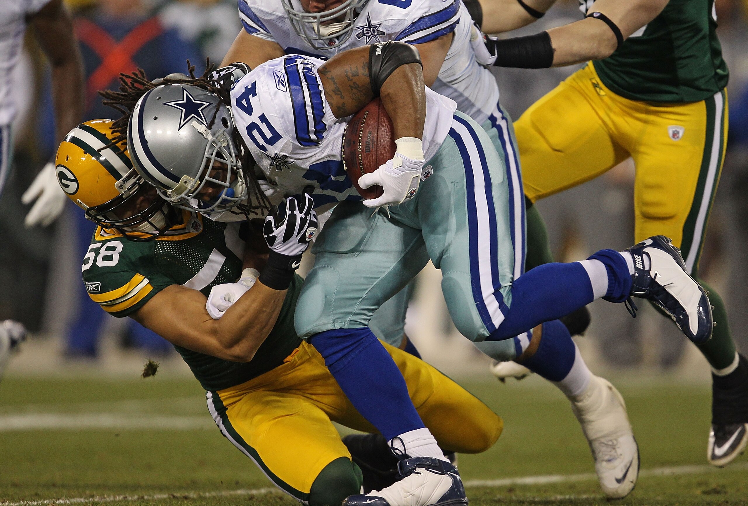 GREEN BAY, WI - NOVEMBER 07: Frank Zombo #58 of the Green Bay Packers tackles Marion Barber #24 of the Dallas Cowboys at Lambeau Field on November 7, 2010 in Green Bay, Wisconsin. (Photo by Jonathan Daniel/Getty Images)
