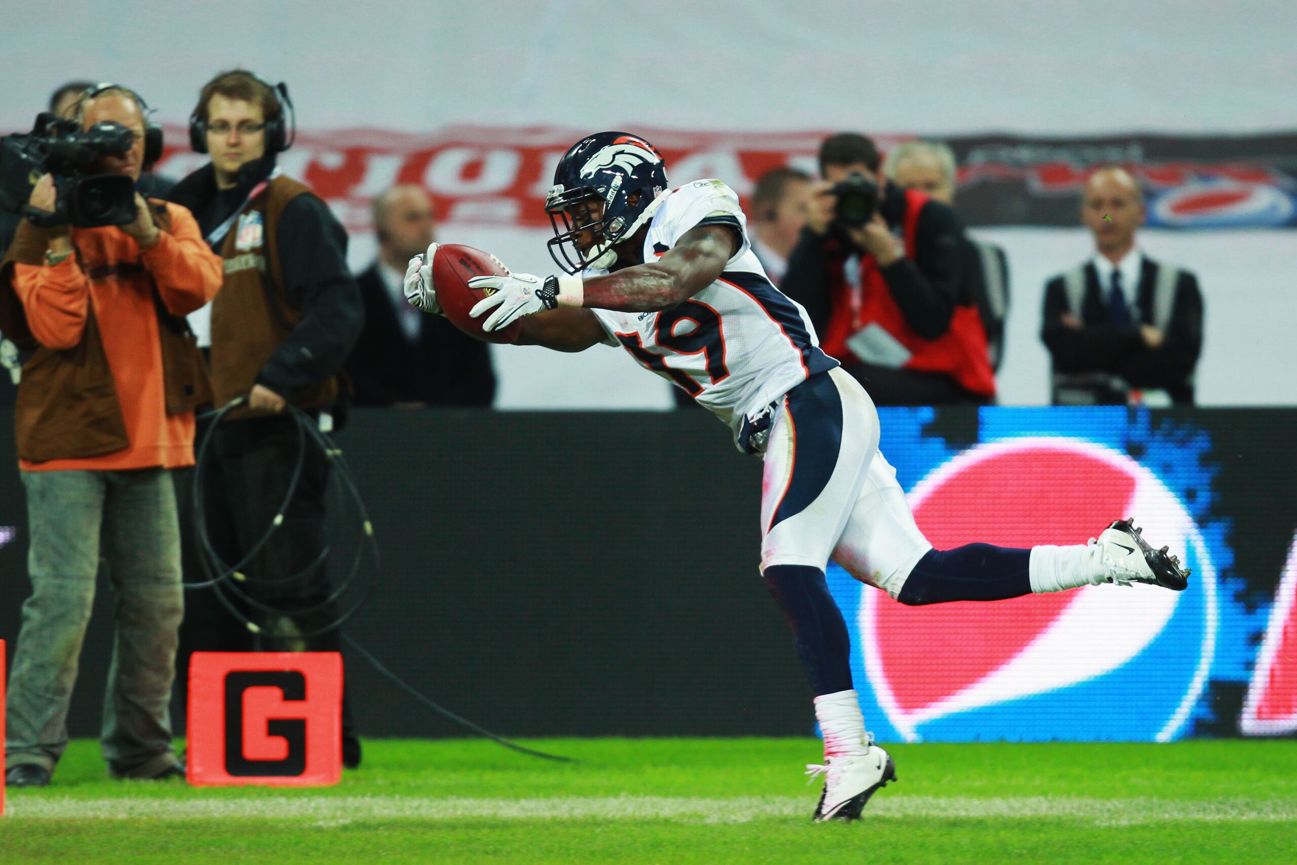 LONDON, ENGLAND - OCTOBER 31:  Eddie Royal #19 of Denver Broncos completes a touchdown that was subsequently disallowed during the NFL International Series match between Denver Broncos and San Francisco 49ers at Wembley Stadium on October 31, 2010 in Lond