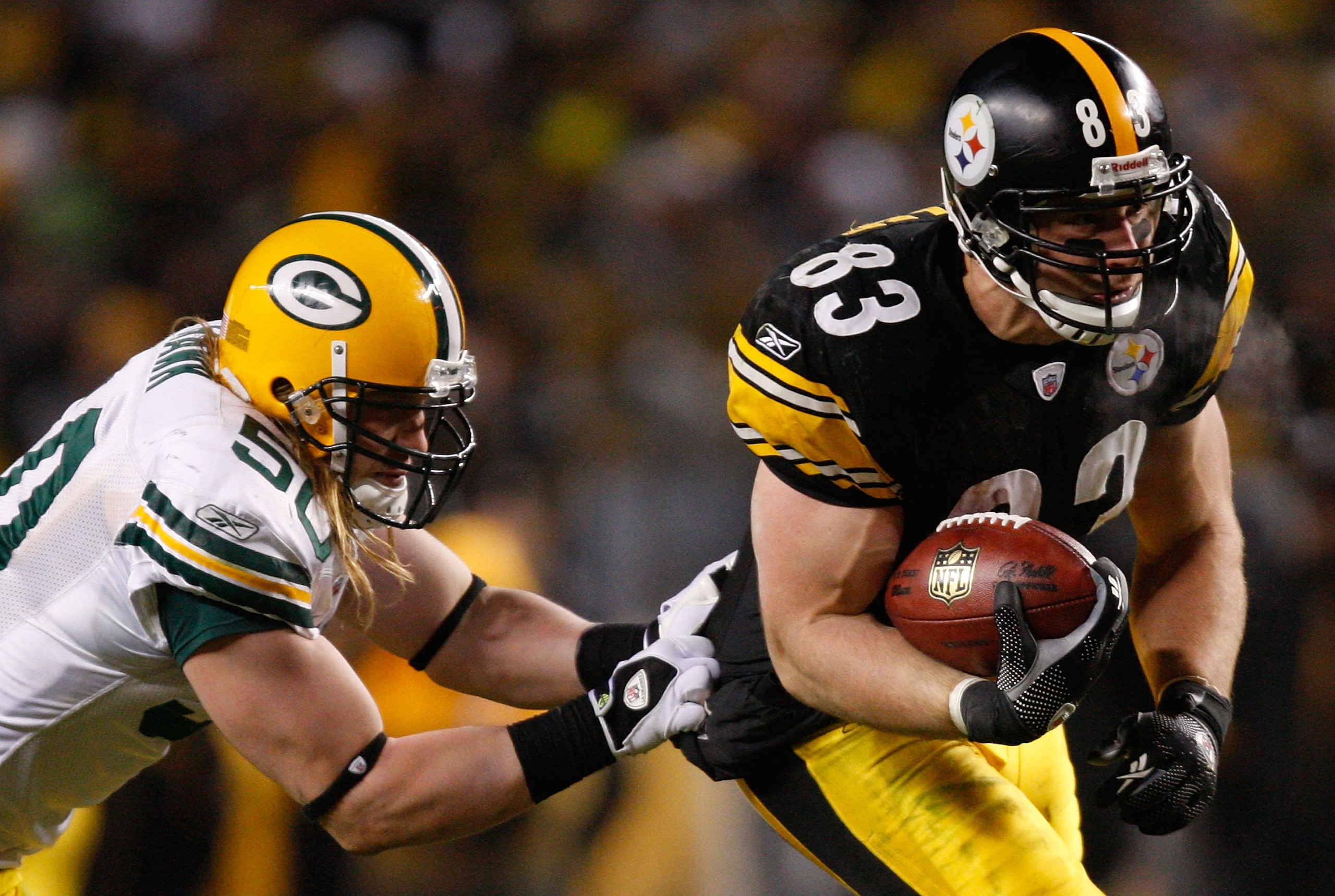 PITTSBURGH - DECEMBER 20: Heath Miller #83 of the Pittsburgh Steelers attempts to break through a tackle by AJ Hawk #50 of the Green Bay Packers during the game on December 20, 2009 at Heinz Field in Pittsburgh, Pennsylvania. (Photo by Jared Wickerham/Get