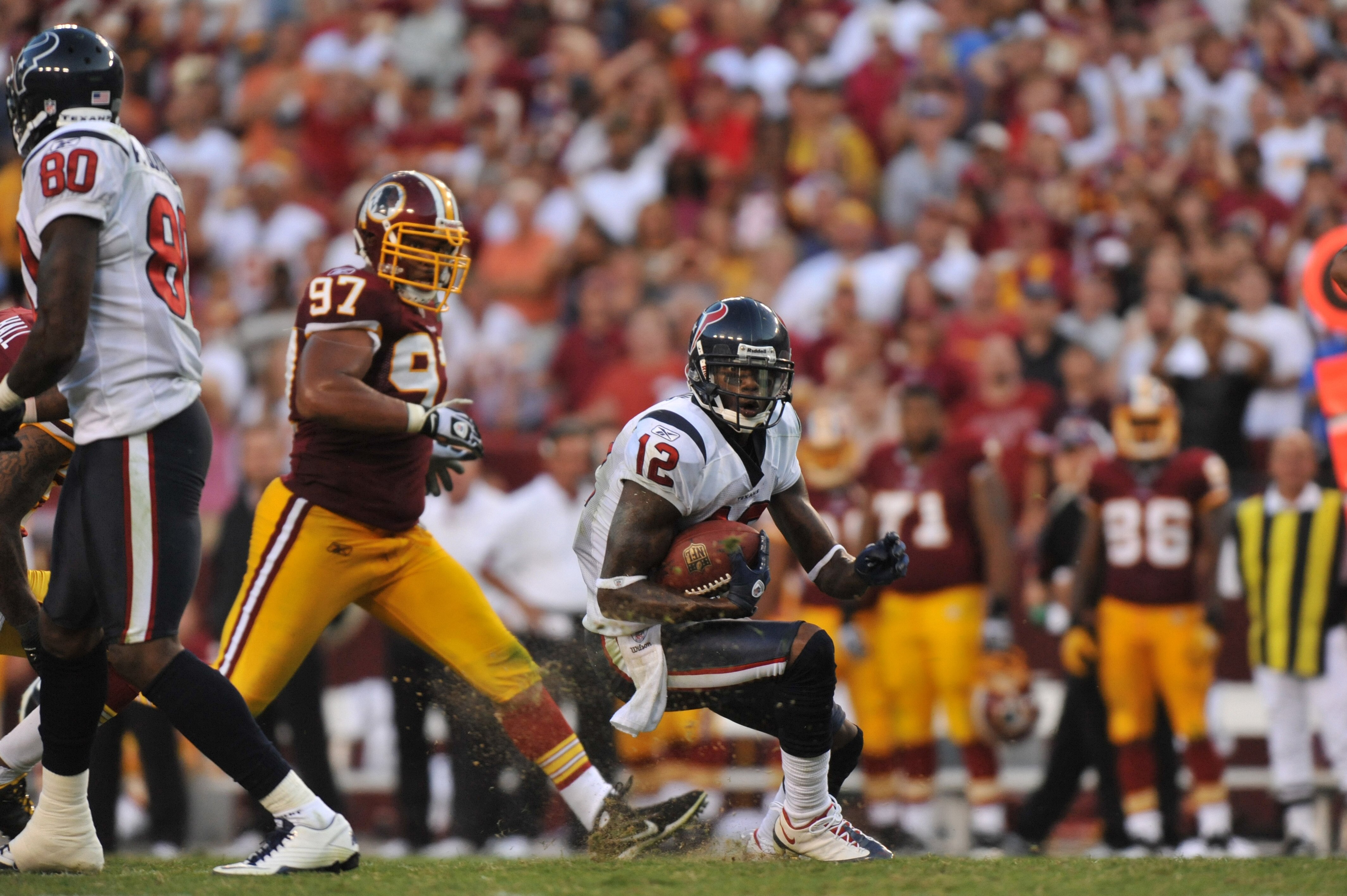 LANDOVER - SEPTEMBER 19:  Jacoby Jones #12 of the Houston Texans runs the ball against the Washington Redskins at FedExField on September 19, 2010 in Landover, Maryland. The Texans defeated the Redskins in overtime 30-27. (Photo by Larry French/Getty Imag