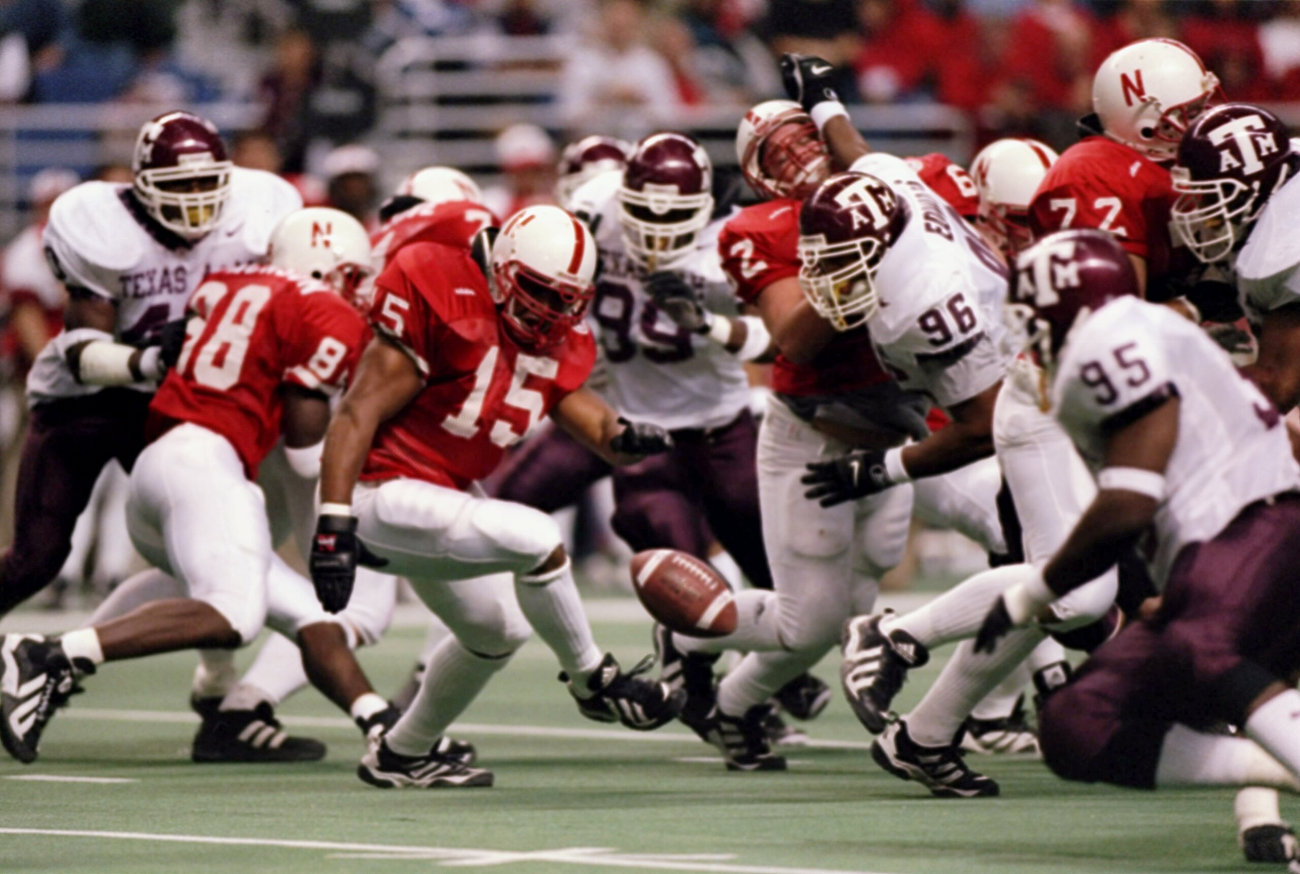 6 Dec 1997:  Willie Miller of the Nebraska Cornhuskers looks at the ball during a game against the Texas A&M Aggies at the Alamodome in San Antonio, Texas.  Nebraska won the game 54-15. Mandatory Credit: Stephen Dunn  /Allsport
