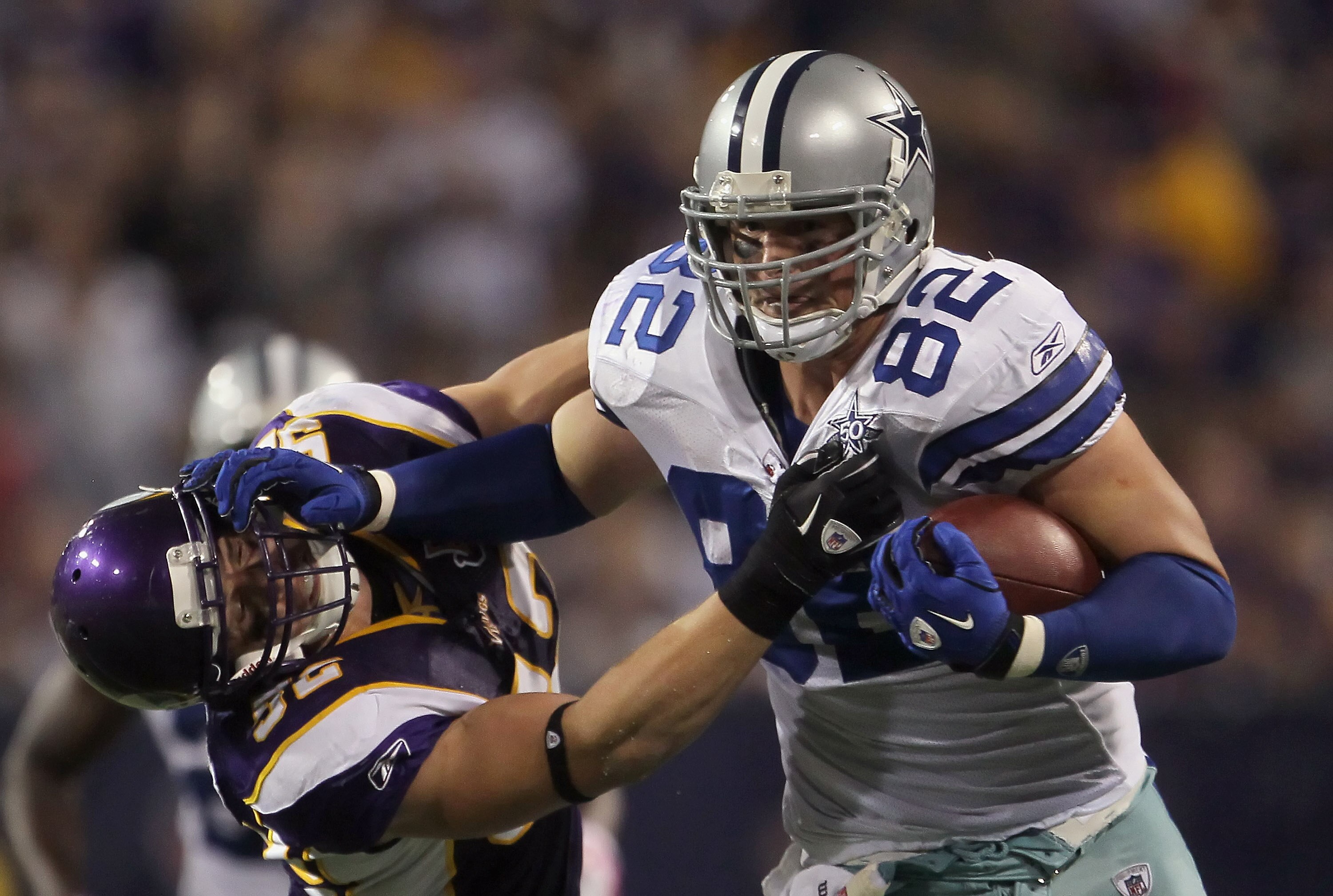 MINNEAPOLIS - OCTOBER 17:  Tight end Jason Witten #82 of the Dallas Cowboys stiff arms Chad Greenway #52 of the Minnesota Vikings during the fourth quarter at Mall of America Field on October 17, 2010 in Minneapolis, Minnesota. The Vikings defeated the Co