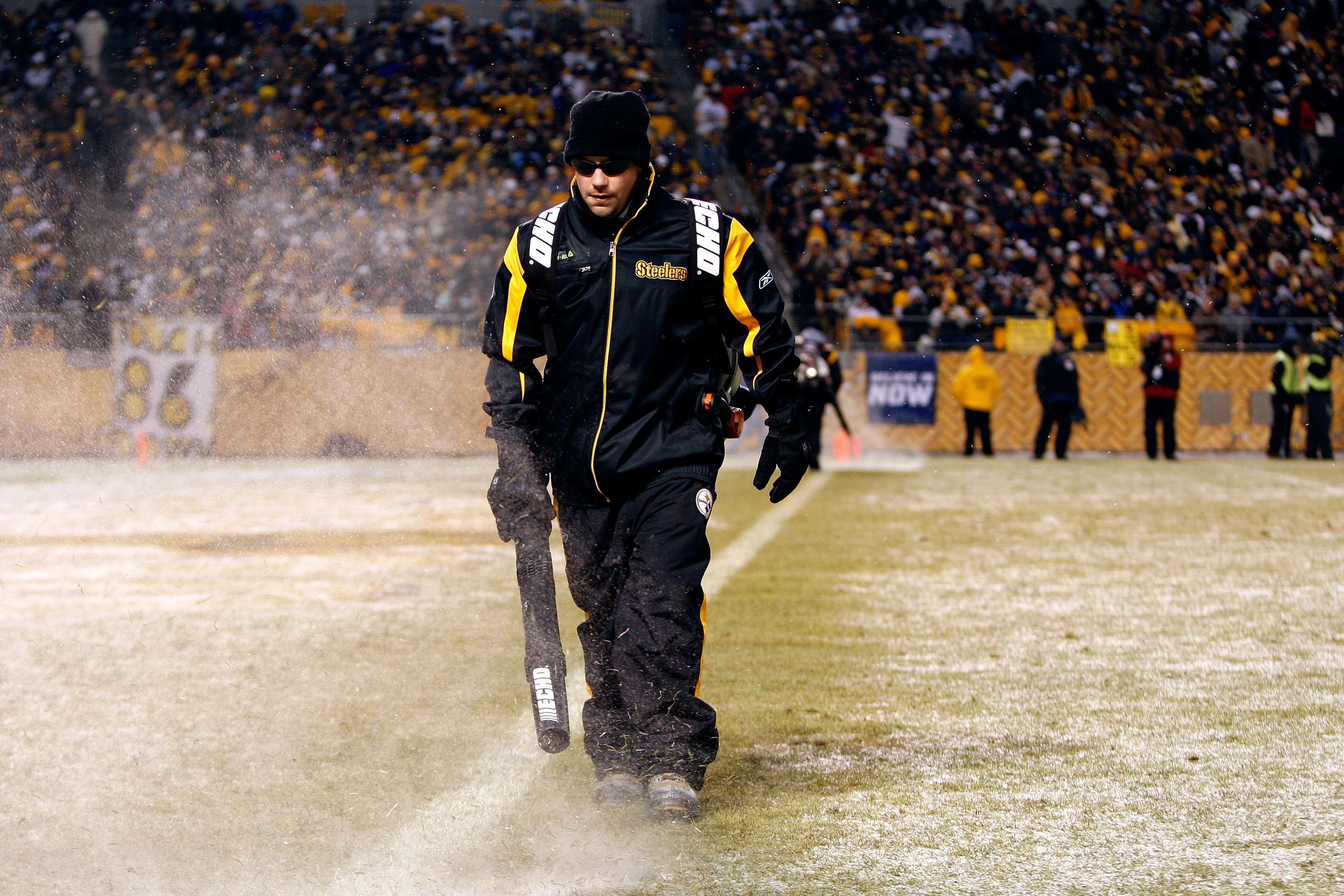 PITTSBURGH - JANUARY 11:  A member of the grounds crew blows snow off of the field during their AFC Divisional Playoff Game between the Pittsburgh Steelers and the San Diego Chargers on January 11, 2009 at Heinz Field in Pittsburgh, Pennsylvania.  (Photo 