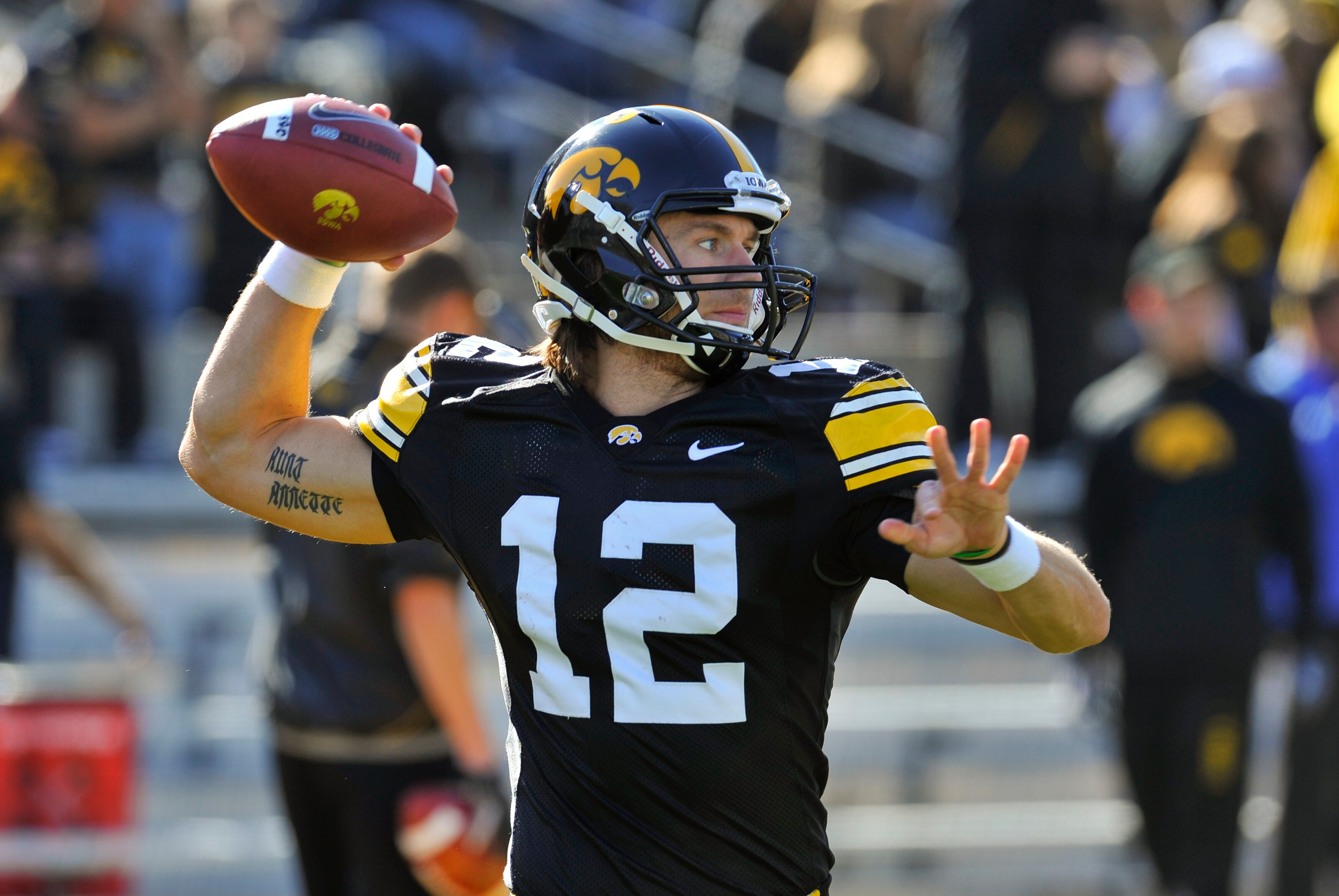 IOWA CITY, IA - OCTOBER 30- Quarterback Ricky Stanzi #12 of the University of Iowa Hawkeyes warms up his throwing arm before play against the Michigan State Spartans at Kinnick Stadium on October 30, 2010 in Iowa City, Iowa. Iowa won 37-6 over Michigan St