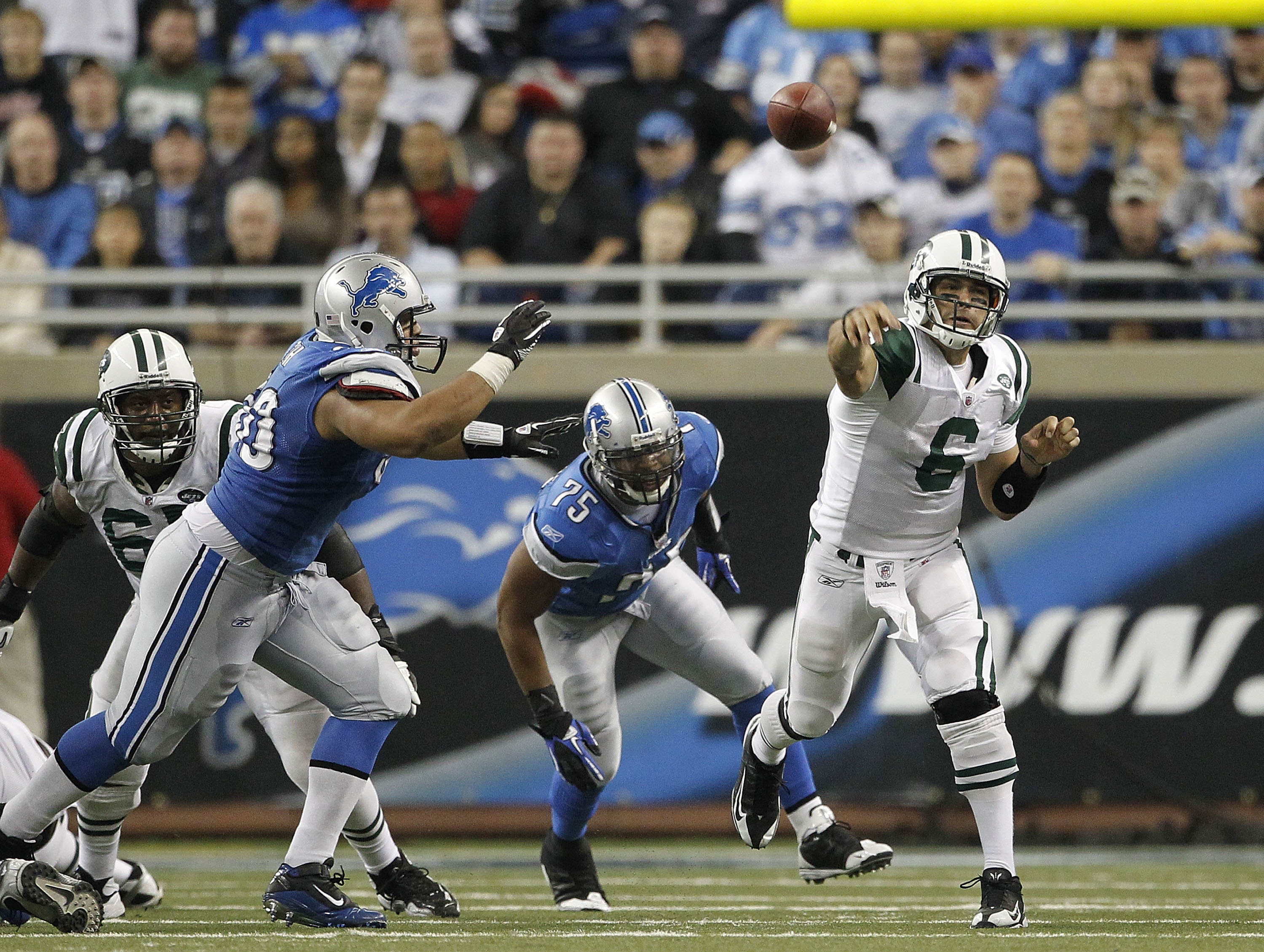 DETROIT - NOVEMBER 07:  Mark Sanchez #6 of the New York Jets throws a pass during the game against the Detroit Lions at Ford Field on November 7, 2010 in Detroit, Michigan. The Jets defeated the Lions 23-20 in overtime.  (Photo by Leon Halip/Getty Images)