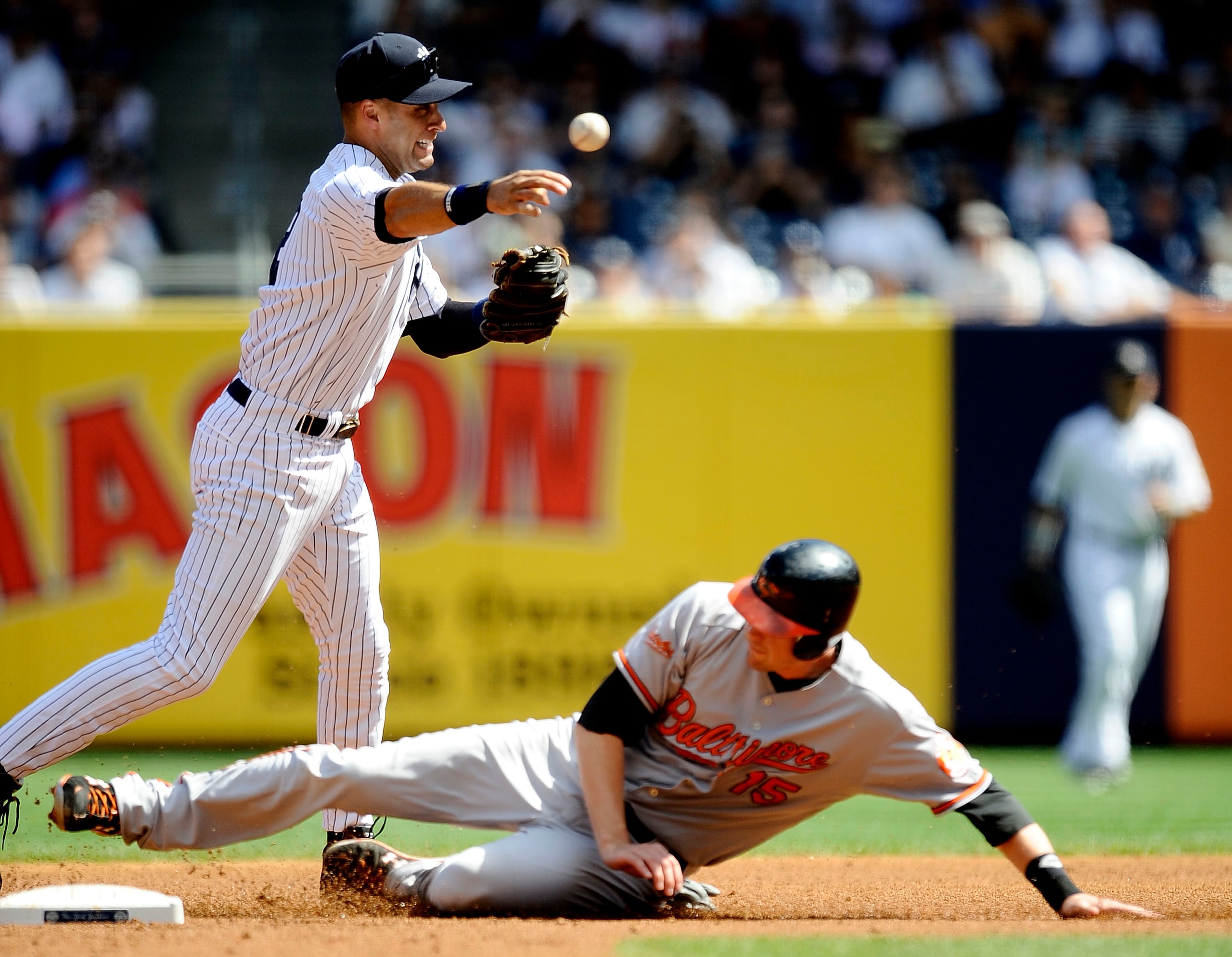 NEW YORK - SEPTEMBER 13: Derek Jeter #2 of the New York Yankees throws to first to force out Matt Wieters #15 of the Baltimore Orioles in the second inning of a game at Yankee Stadium on September 13, 2009 in the Bronx borough of New York City. (Photo b NEW YORK - SEPTEMBER 13: Derek Jeter #2 of the New York Yankees throws to first to force out Matt Wieters #15 of the Baltimore Orioles in the second inning of a game at Yankee Stadium on September 13, 2009 in the Bronx borough of New York City. (Photo b