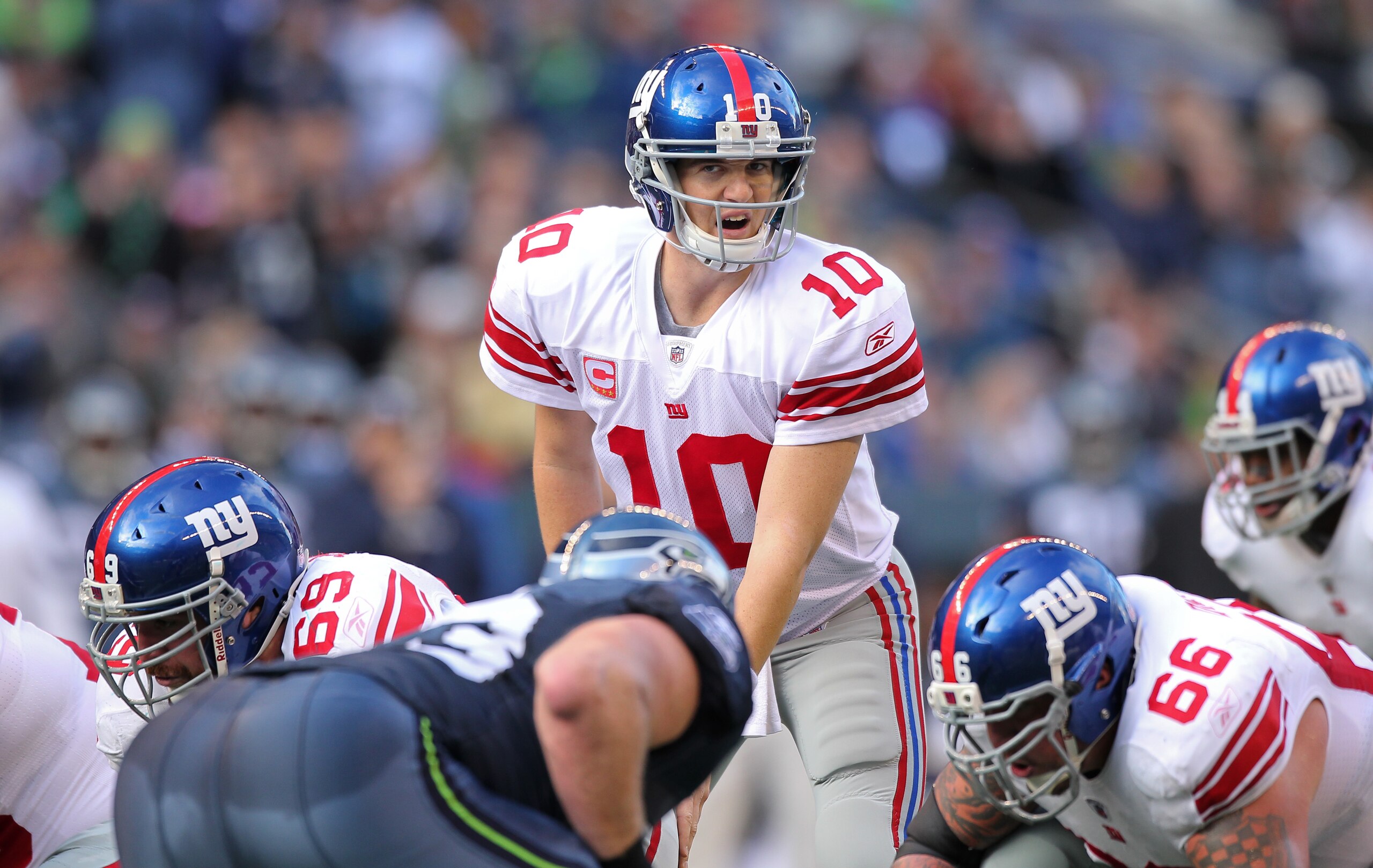 SEATTLE - NOVEMBER 07:  Quarterback Eli Manning #10 of the New York Giants looks over the defense at the line of scrimmage against the Seattle Seahawks at Qwest Field on November 7, 2010 in Seattle, Washington. The Giants defeated the Seahawks 41-7. (Phot