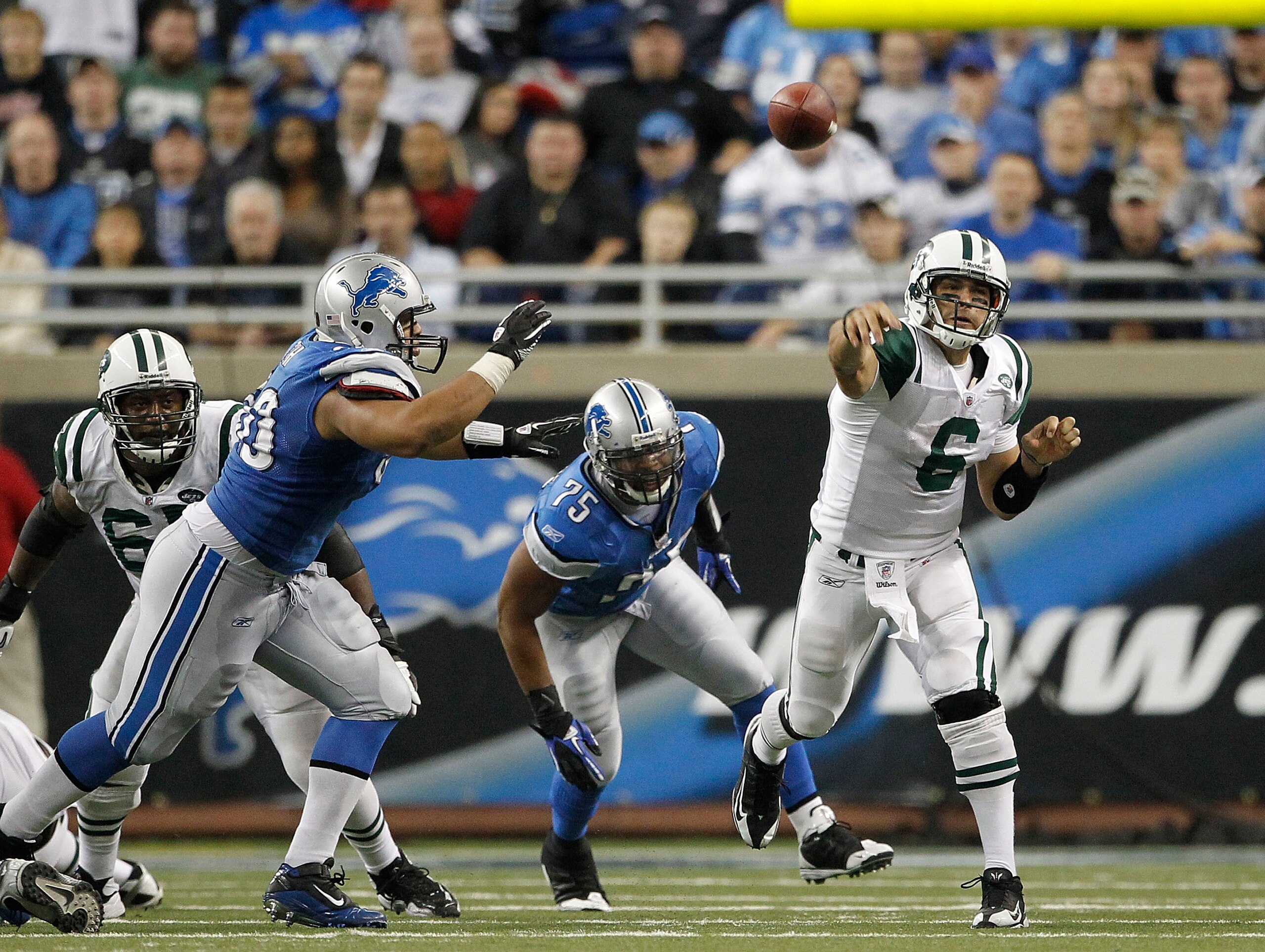 DETROIT - NOVEMBER 07:  Mark Sanchez #6 of the New York Jets throws a pass during the game against the Detroit Lions at Ford Field on November 7, 2010 in Detroit, Michigan. The Jets defeated the Lions 23-20 in overtime.  (Photo by Leon Halip/Getty Images)