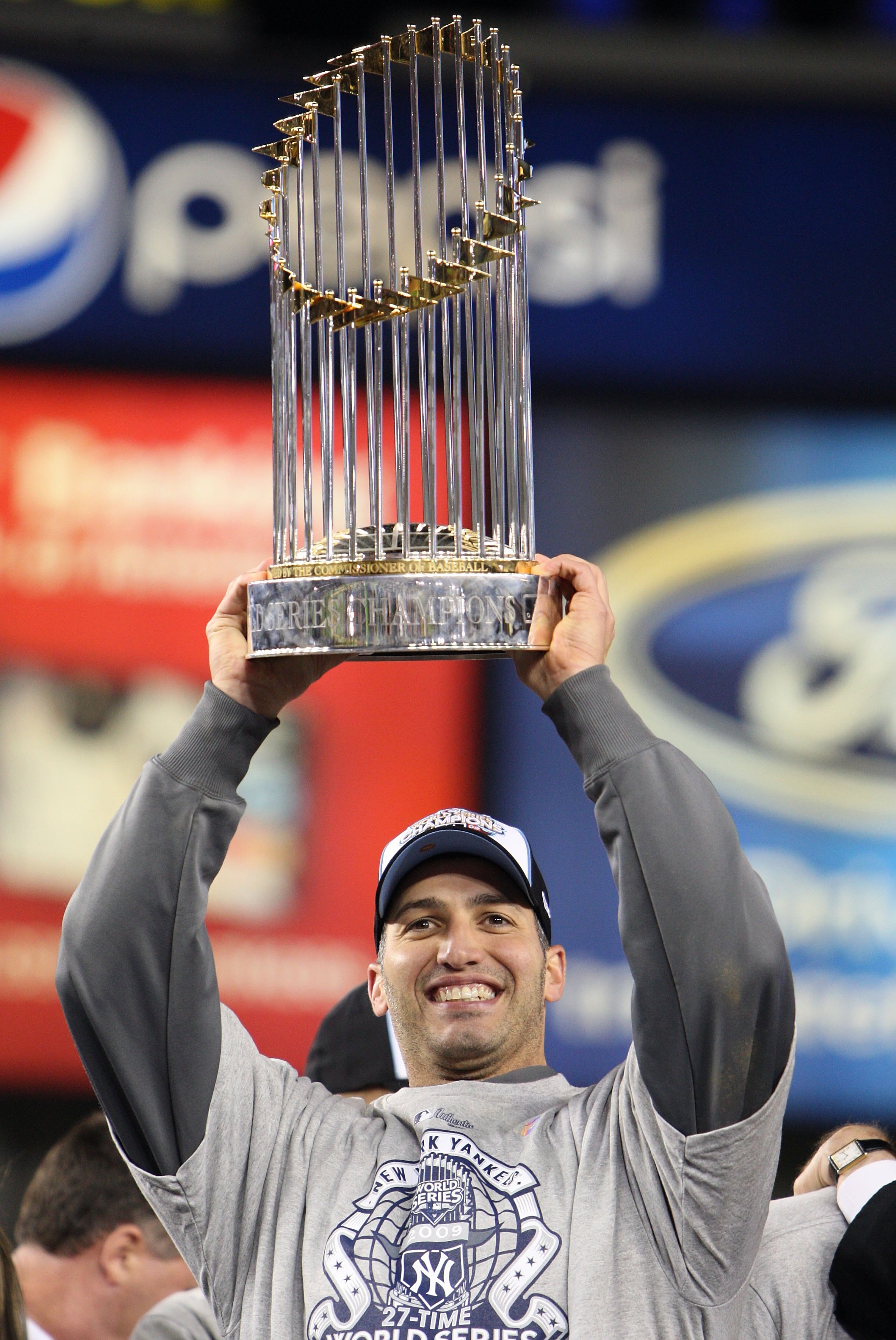 NEW YORK - NOVEMBER 04:  Andy Pettitte #46 of the New York Yankees celebrates with the trophy after their 7-3 win against the Philadelphia Phillies in Game Six of the 2009 MLB World Series at Yankee Stadium on November 4, 2009 in the Bronx borough of New