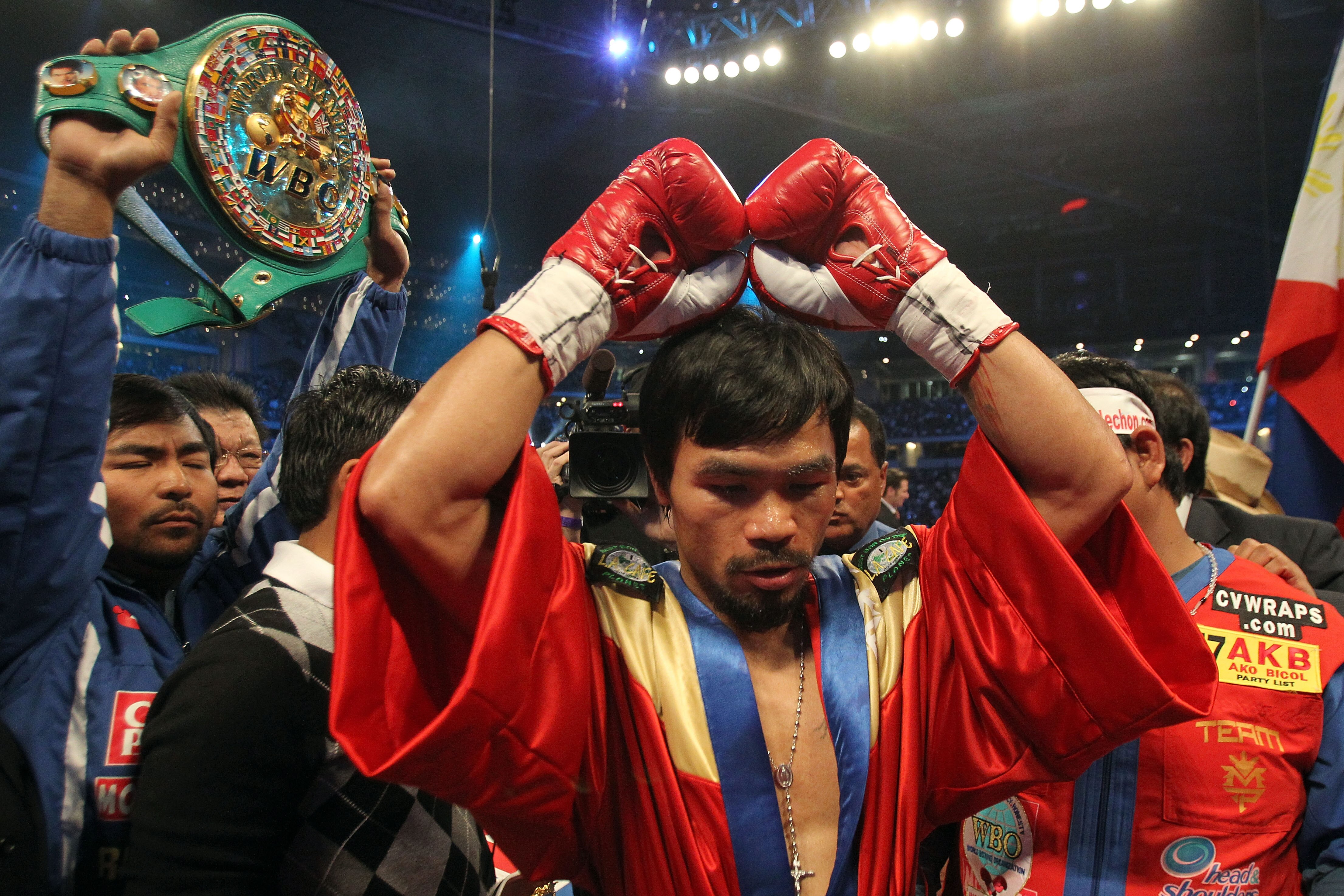 ARLINGTON, TX - MARCH 13:  Manny Pacquiao of the Philippines in the ring before taking on Joshua Clottey of Ghana during the WBO welterweight title fight at Cowboys Stadium on March 13, 2010 in Arlington, Texas.  (Photo by Jed Jacobsohn/Getty Images)