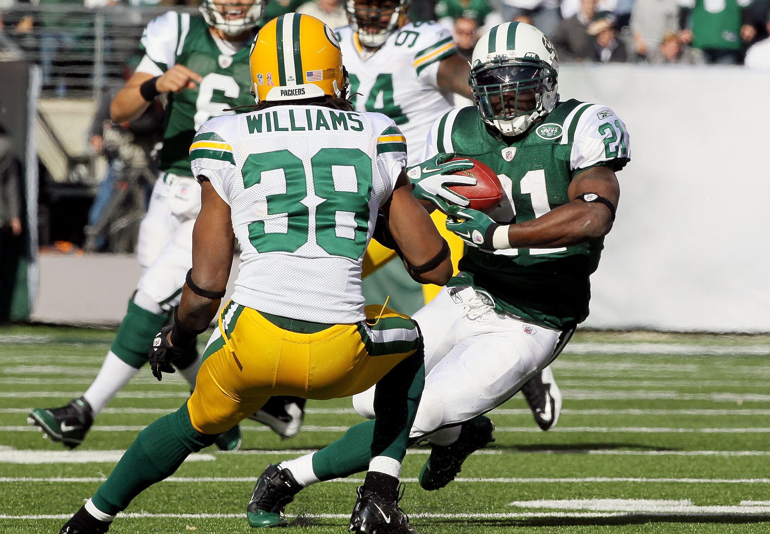 EAST RUTHERFORD, NJ - OCTOBER 31:  LaDainian Tomlinson #21 of the New York Jets runs the ball against Tramon Williams #38 of the Green Bay Packers on October 31, 2010 at the New Meadowlands Stadium in East Rutherford, New Jersey.  (Photo by Jim McIsaac/Ge
