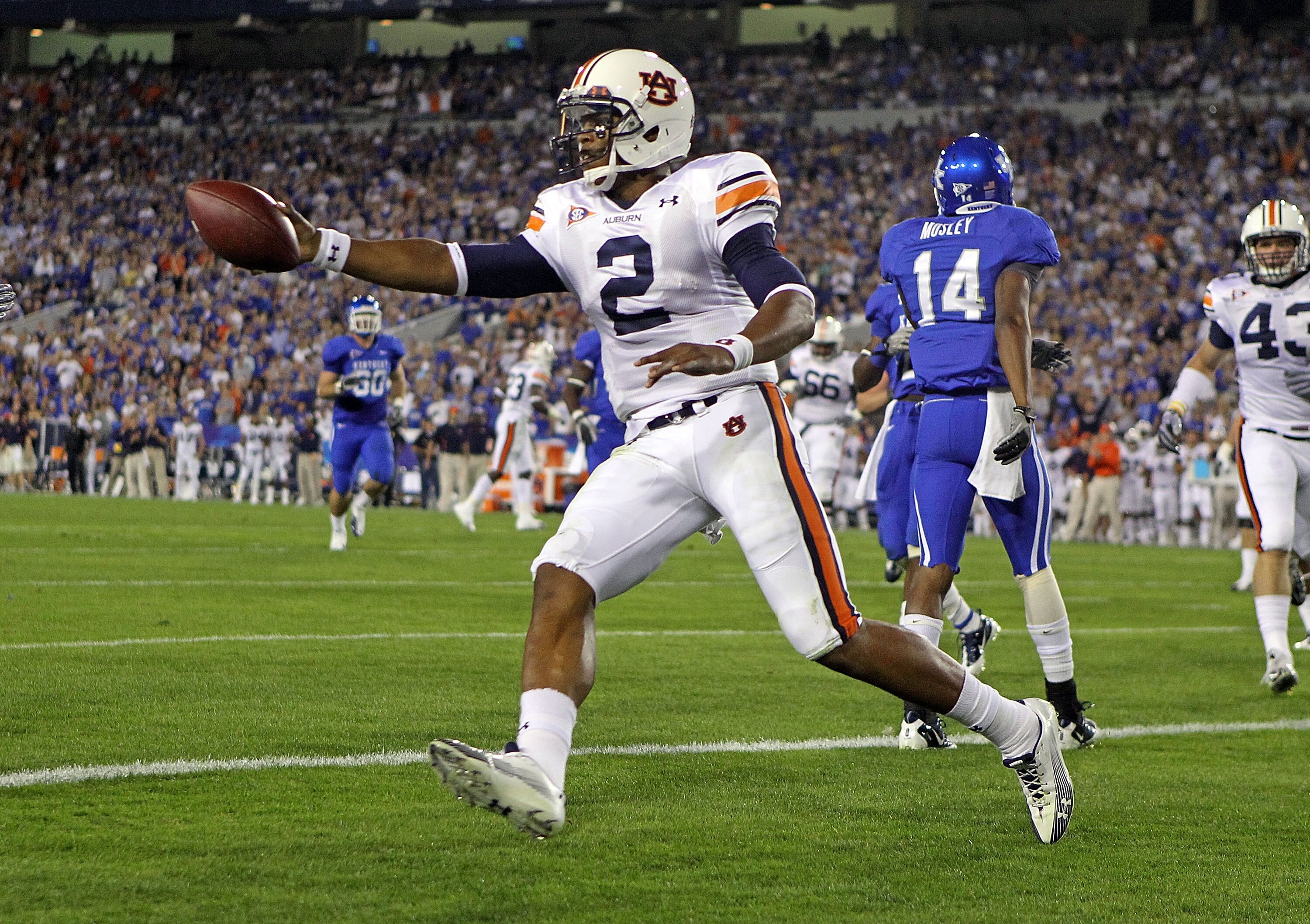 LEXINGTON, KY - OCTOBER 09:  Cam Newton #2 of the Auburn Tigers celebrates after scoring a touchdown during the SEC game against the Kentucky Wildcats at Commonwealth Stadium on October 9, 2010 in Lexington, Kentucky.  (Photo by Andy Lyons/Getty Images)