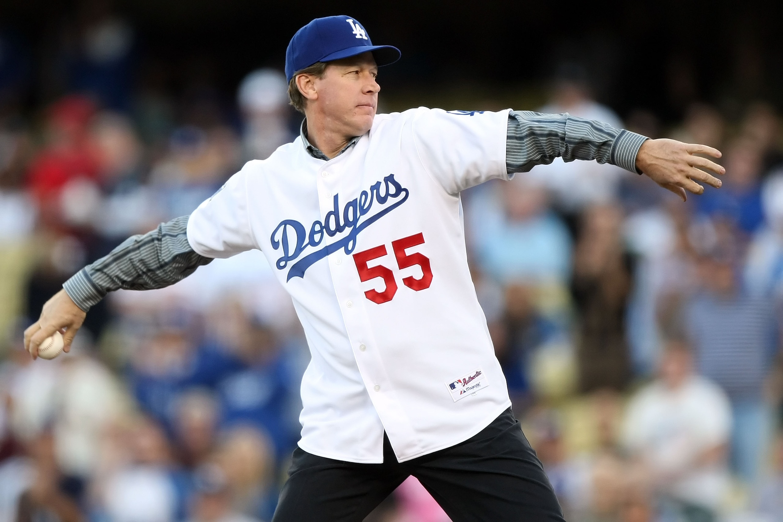 LOS ANGELES, CA - OCTOBER 13:  Former Los Angeles Dodgers pitcher Orel Hershiser throws out the first pitch before the Dodgers take on the Philadelphia Phillies in Game Four of the National League Championship Series during the 2008 MLB playoffs on Octobe