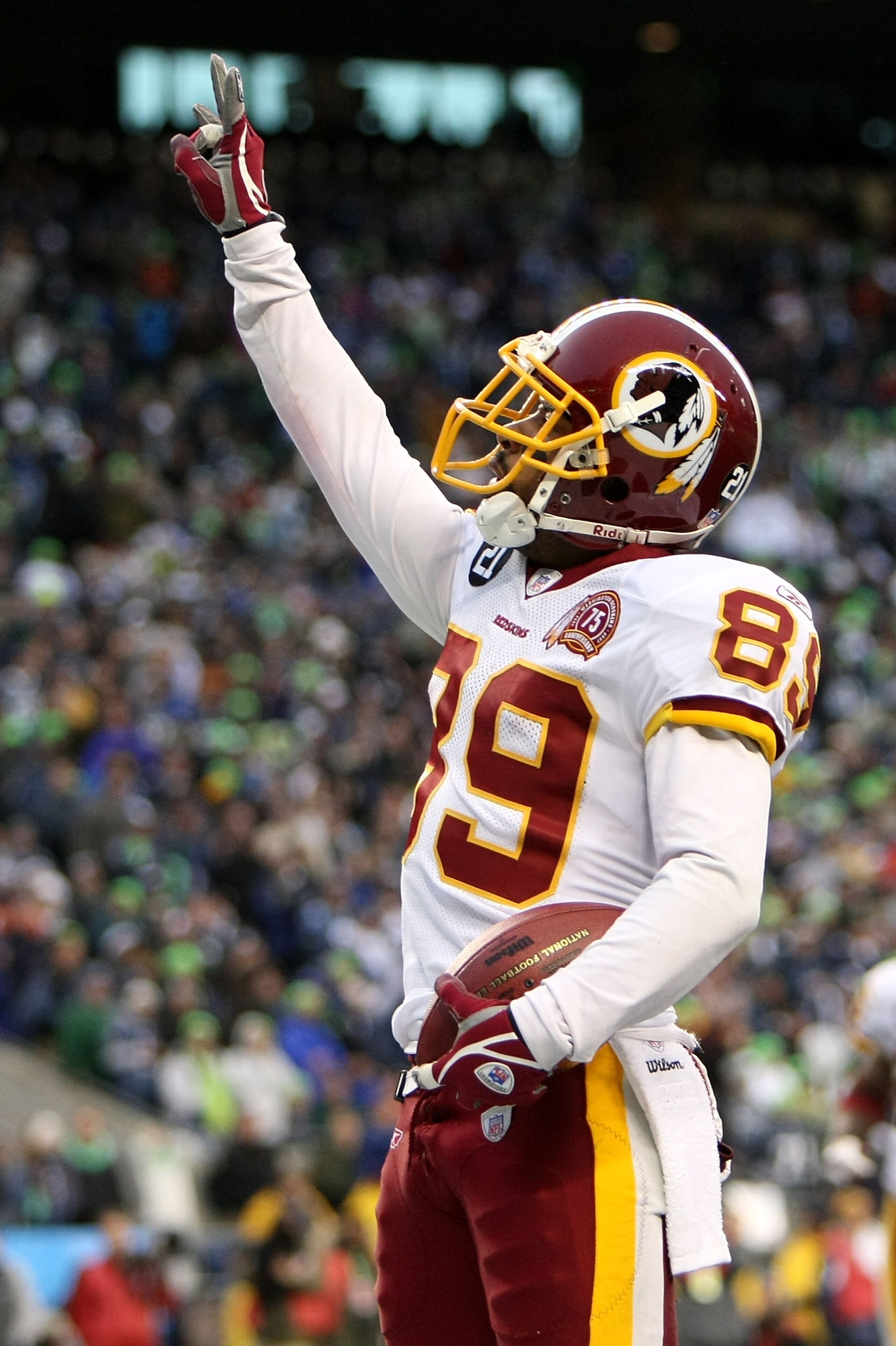 SEATTLE - JANUARY 05:  Wide receiver Santana Moss #89 of the Washington Redskins scores a touchdown on a 30-yard pass in the fourth quarter against the Seattle Seahawks during the NFC Wild Card game at Qwest Field on January 5, 2008 in Seattle, Washington