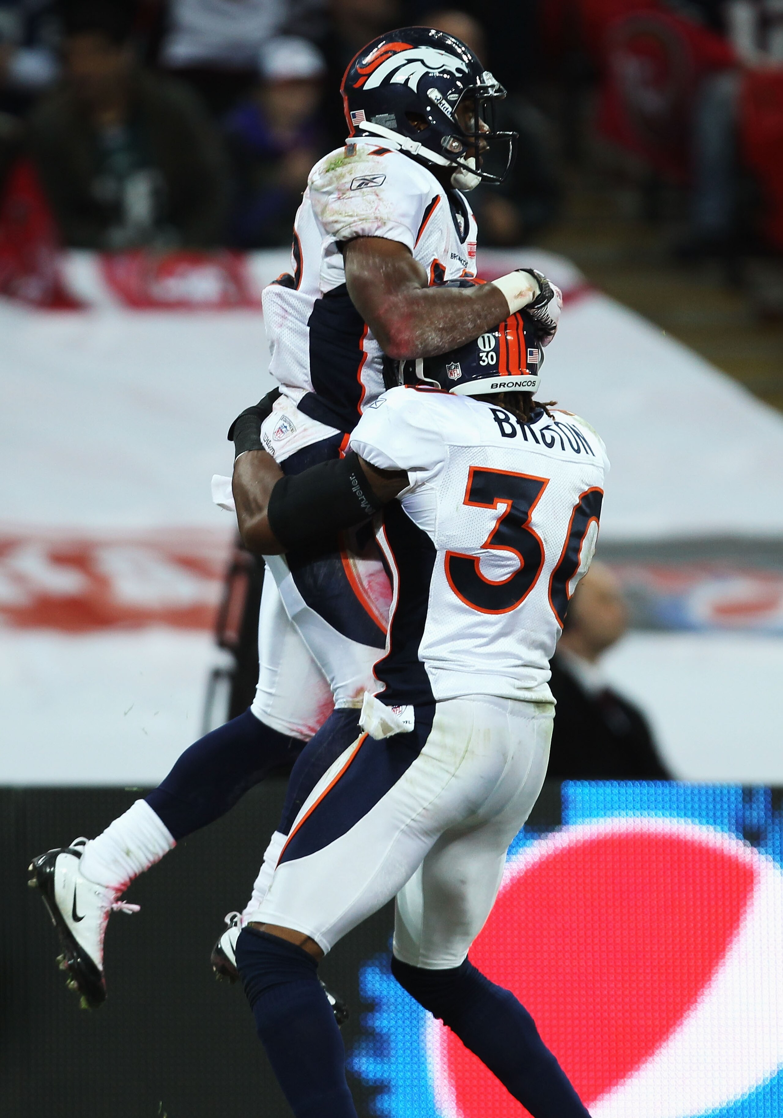 LONDON, ENGLAND - OCTOBER 31:  Eddie Royal #19 of Denver Broncos and David Bruton #30 of Denver Broncos celebrate a touchdown that was subsequently disallowed during the NFL International Series match between Denver Broncos and San Francisco 49ers at Wemb