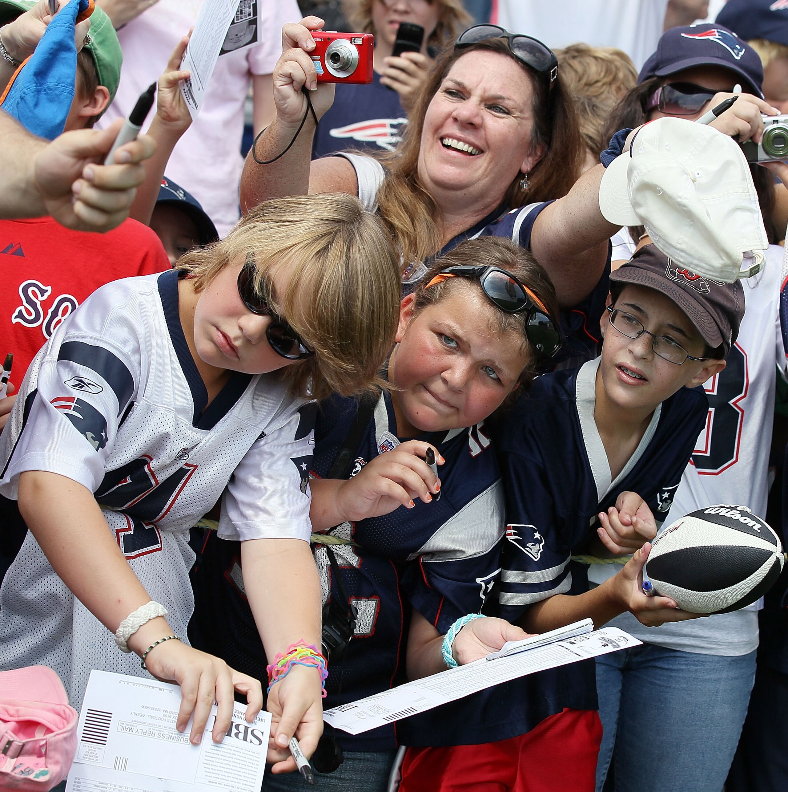 FOXBORO, MA - AUGUST 02:  Fans wait for player autographs after the New England Patriots training camp on August 2, 2010 at Gillette Stadium in Foxboro, Massachusetts.  (Photo by Elsa/Getty Images)