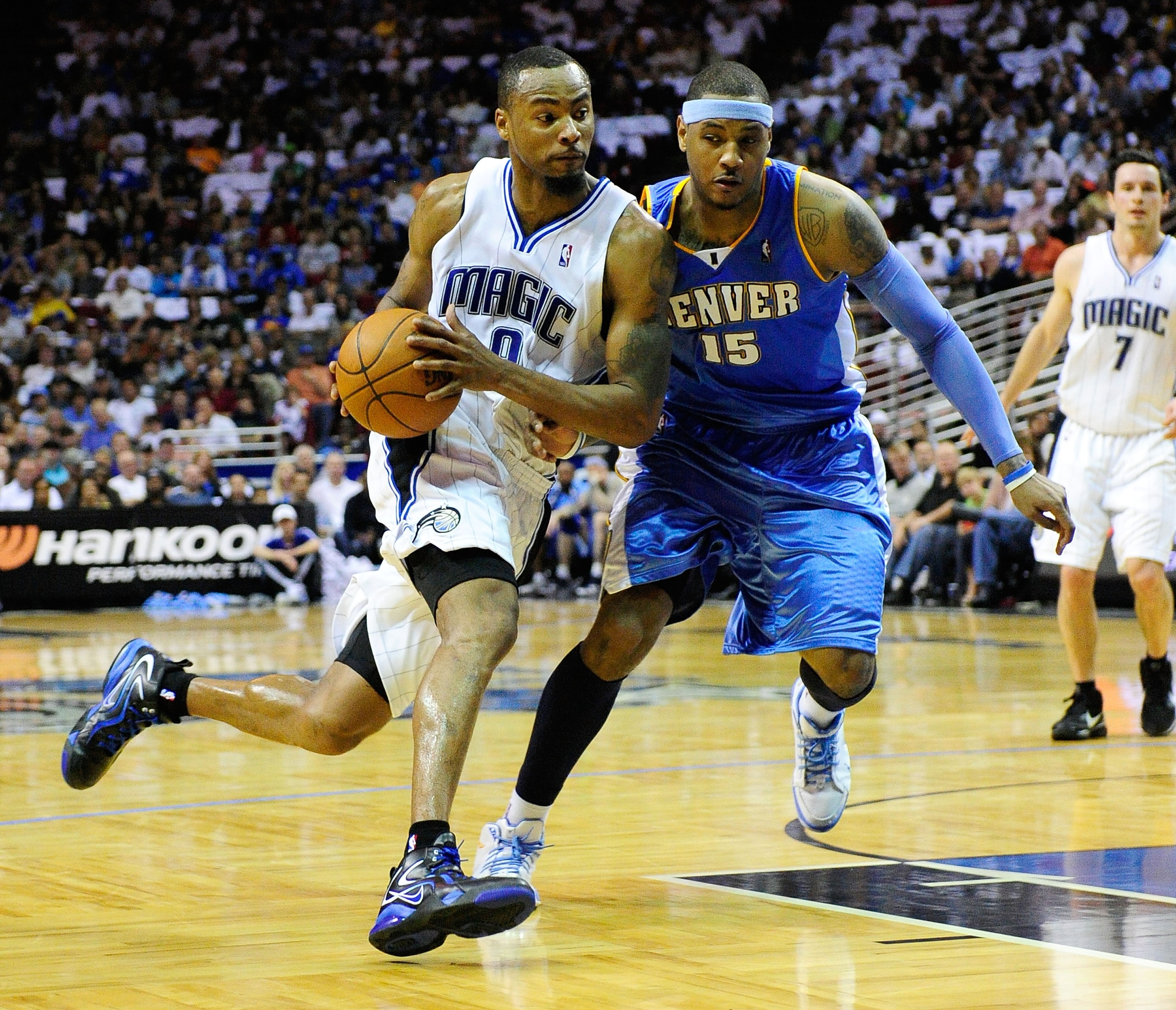 ORLANDO, FL - MARCH 28:  Rashard Lewis #9 of the Orlando Magic drives against Carmelo Anthony #15 of the Denver Nuggets during the game at Amway Arena on March 28, 2010 in Orlando, Florida.  NOTE TO USER: User expressly acknowledges and agrees that, by do