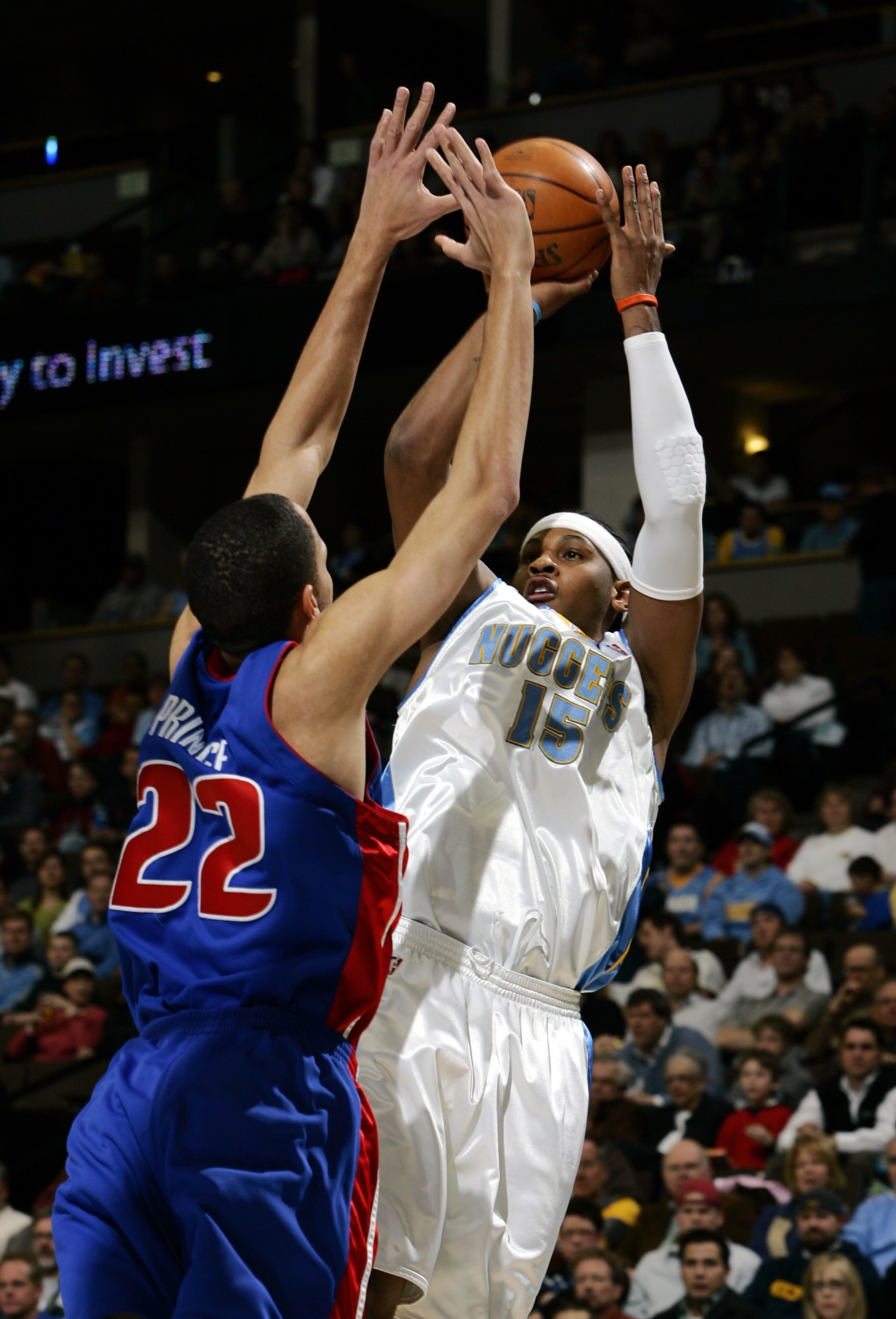 DENVER - MARCH 1:  Carmelo Anthony #15 of the Denver Nuggets puts up a shot over Tayshaun Prince #22 of the Detroit Pistons in the first quarter on March 1, 2006 at the Pepsi Center in Denver, Colorado.  NOTE TO USER: USER expressly acknowledges and agree