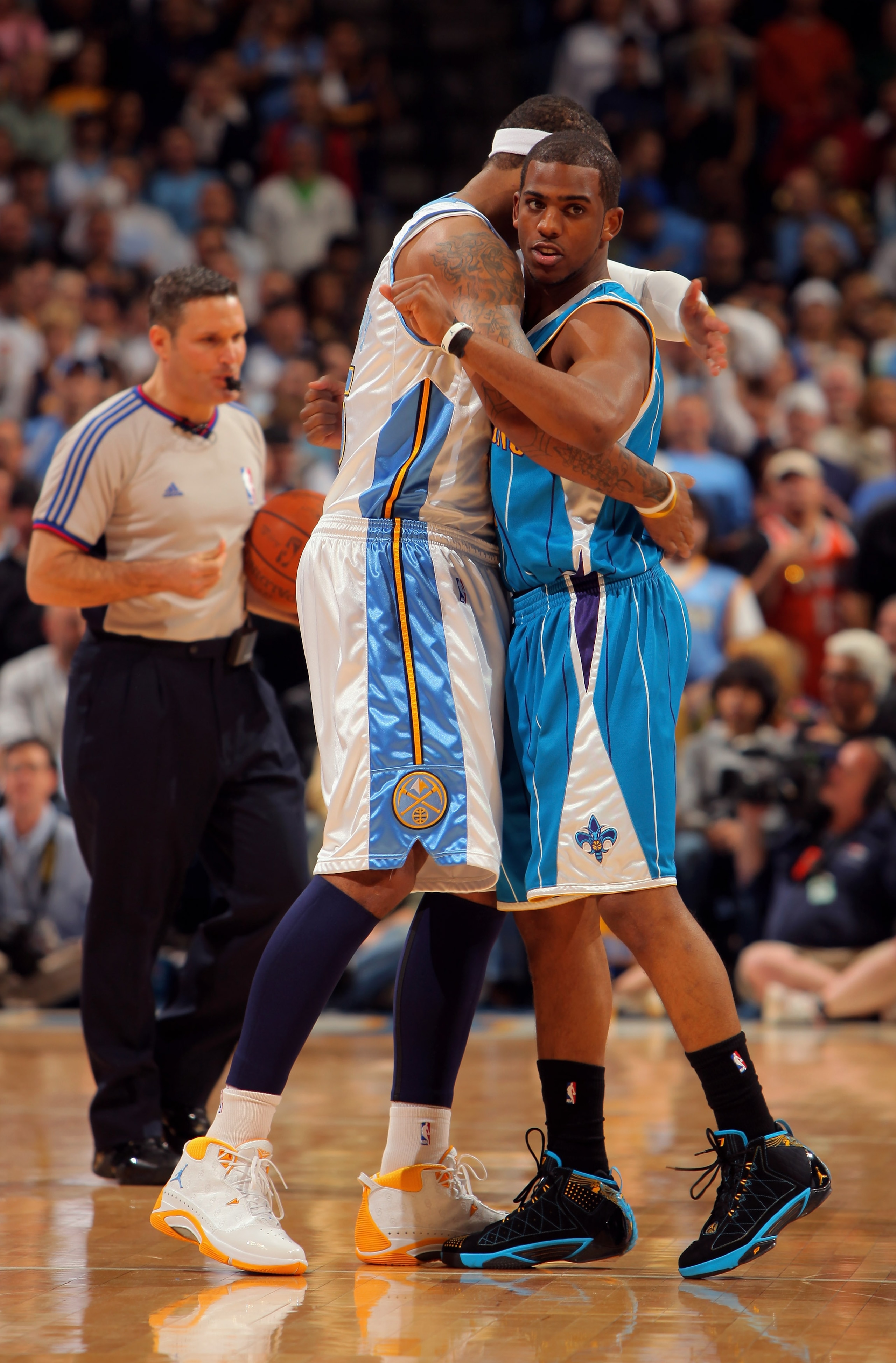 DENVER - APRIL 19:  Chris Paul #3 of the New Orleans Hornets and Carmelo Anthony #15 of the Denver Nuggets greet one another prior to tip off of Game One of the Western Conference Quarterfinals during the 2009 NBA Playoffs at Pepsi Center on April 19, 200